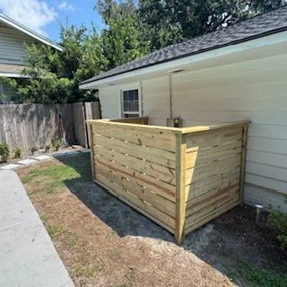 Handcrafted wood pool equipment screen built in Ortega, Jacksonville, Florida, offering durable outdoor protection and a clean, finished backyard appearance.