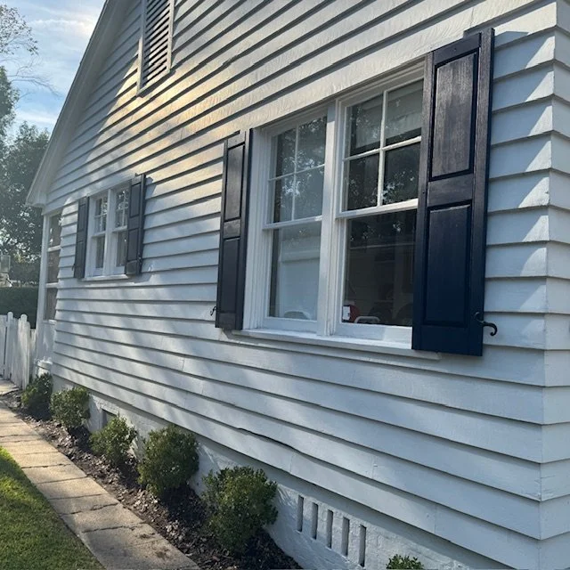 
Exterior shutter installation along the side of an Avondale Jacksonville home, featuring durable wood construction and clean architectural lines.