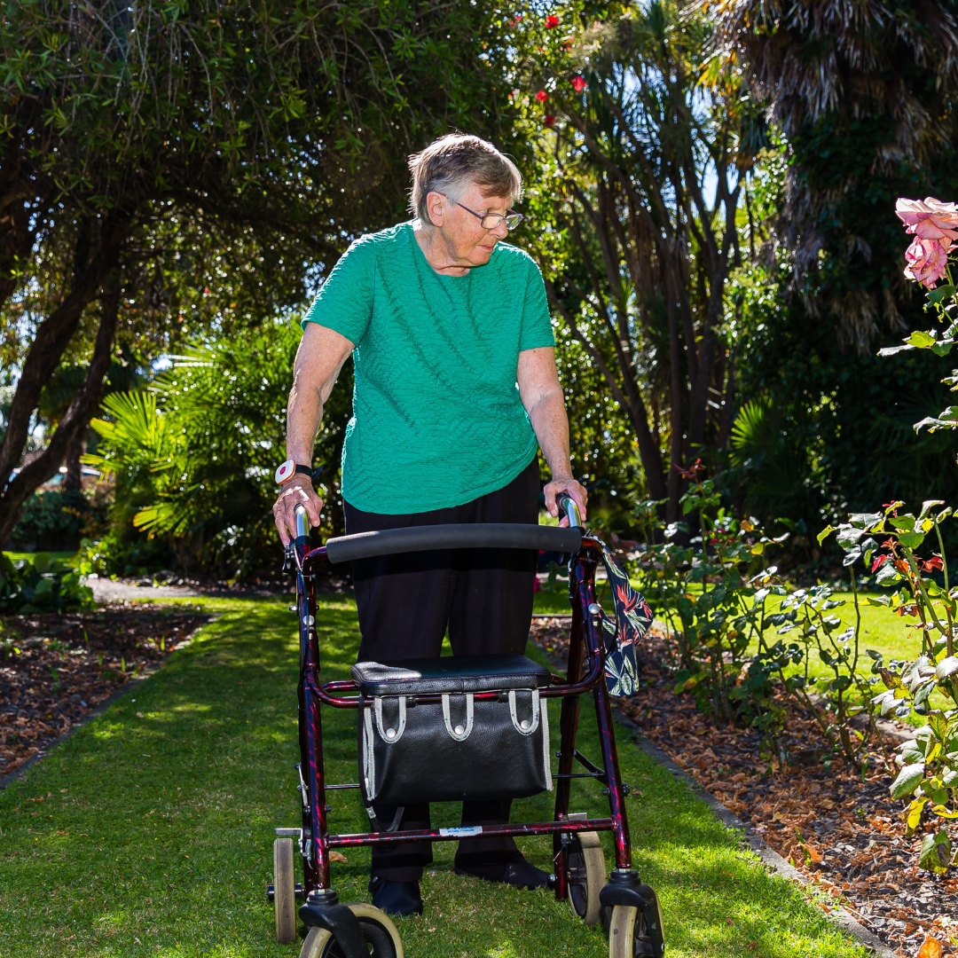 Uploaded lady walking in garden.png