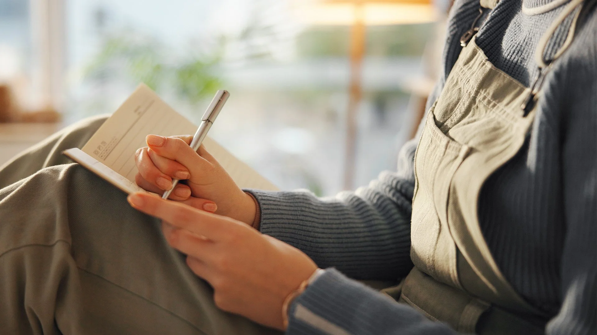 A young women journaling.