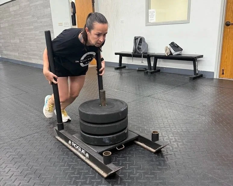 Hyrox sled by a member pushing for workout training