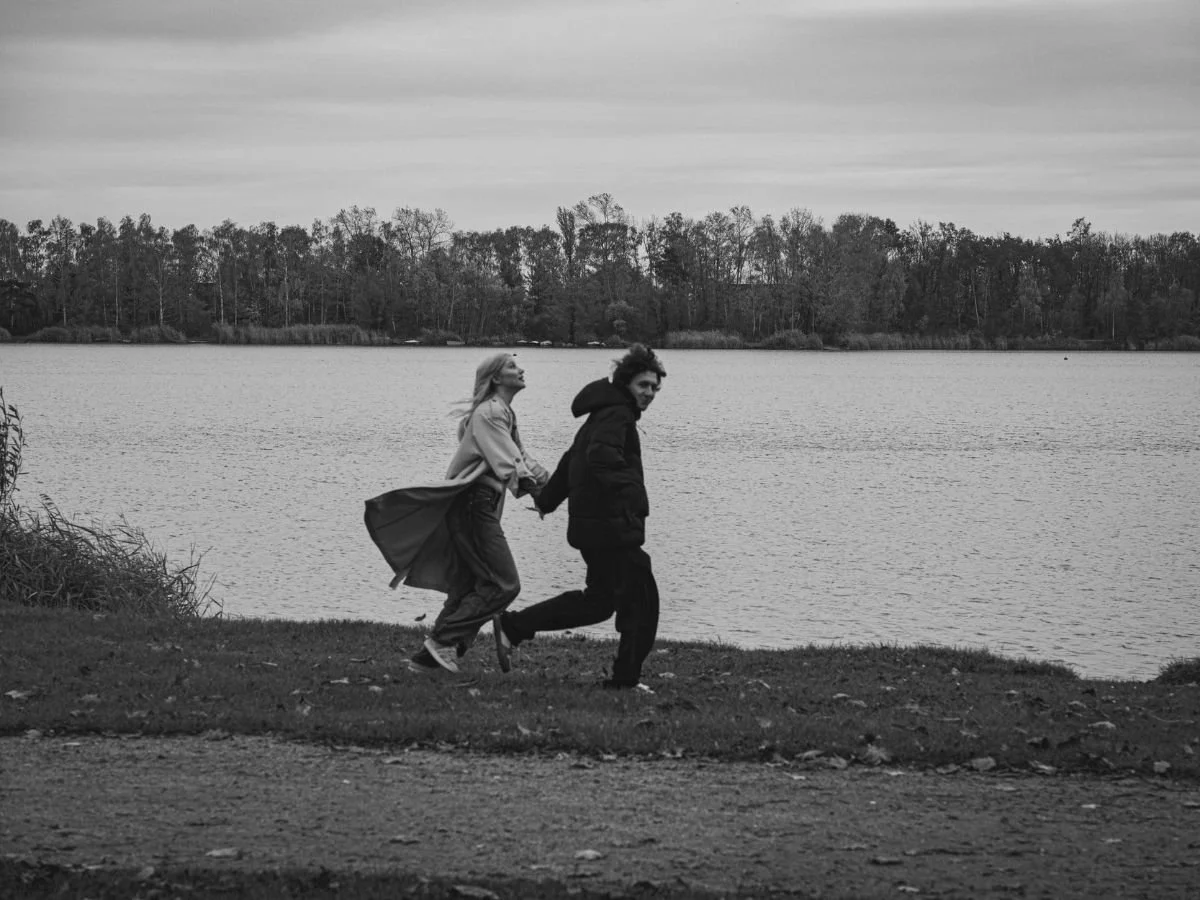 black and white picture of couple running