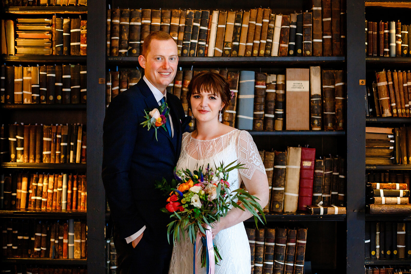 Beautiful wedding couple in the reading room. Photo by About Today Photography