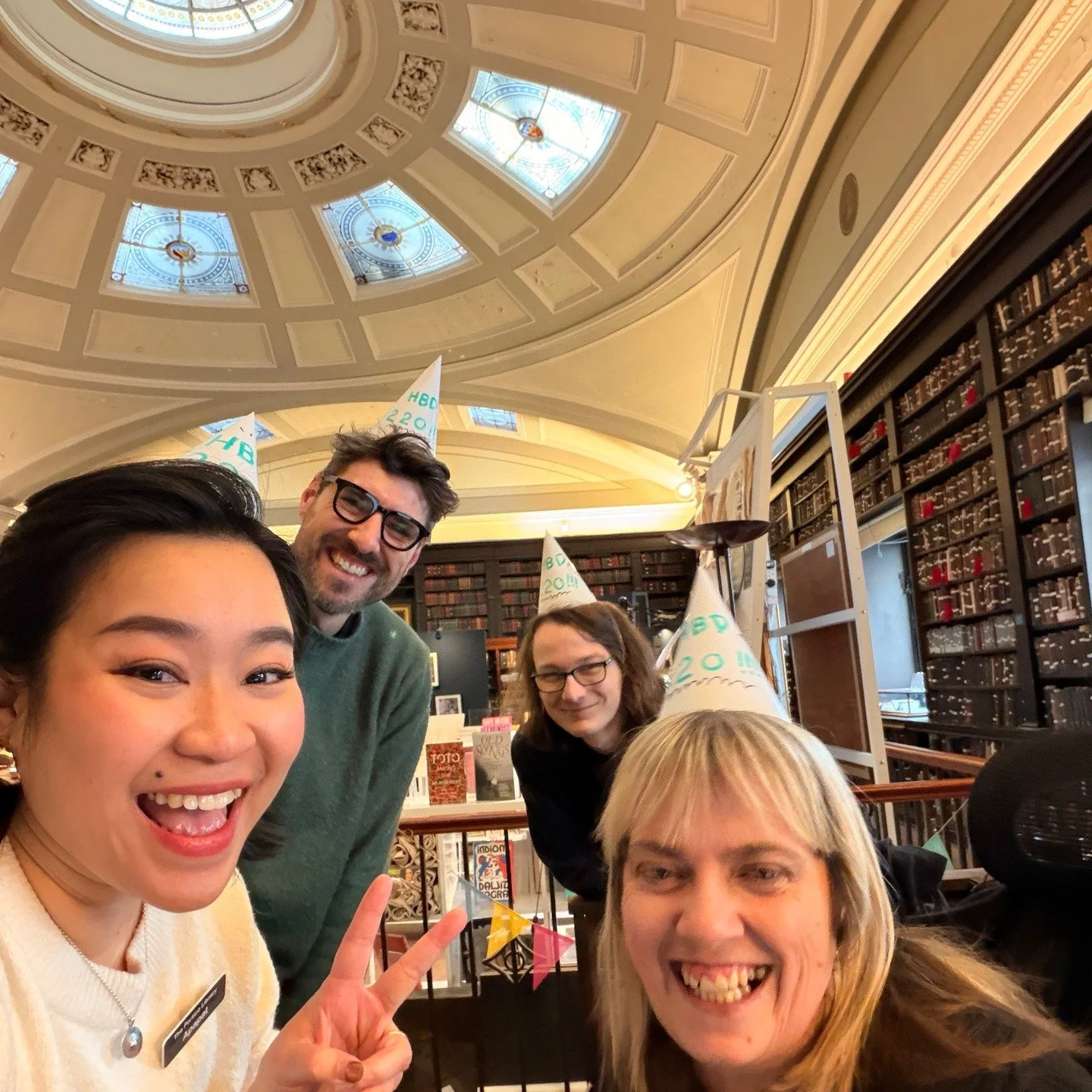 And on our 220th birthday, we're all dining hats so you can't escape if you wander into the Portico today. Here's the team Apapat, Michelle, Jack and Thom all wearing a hat, then Grace and Apapat and Lea our intern. There was no escape for Debbie, ev