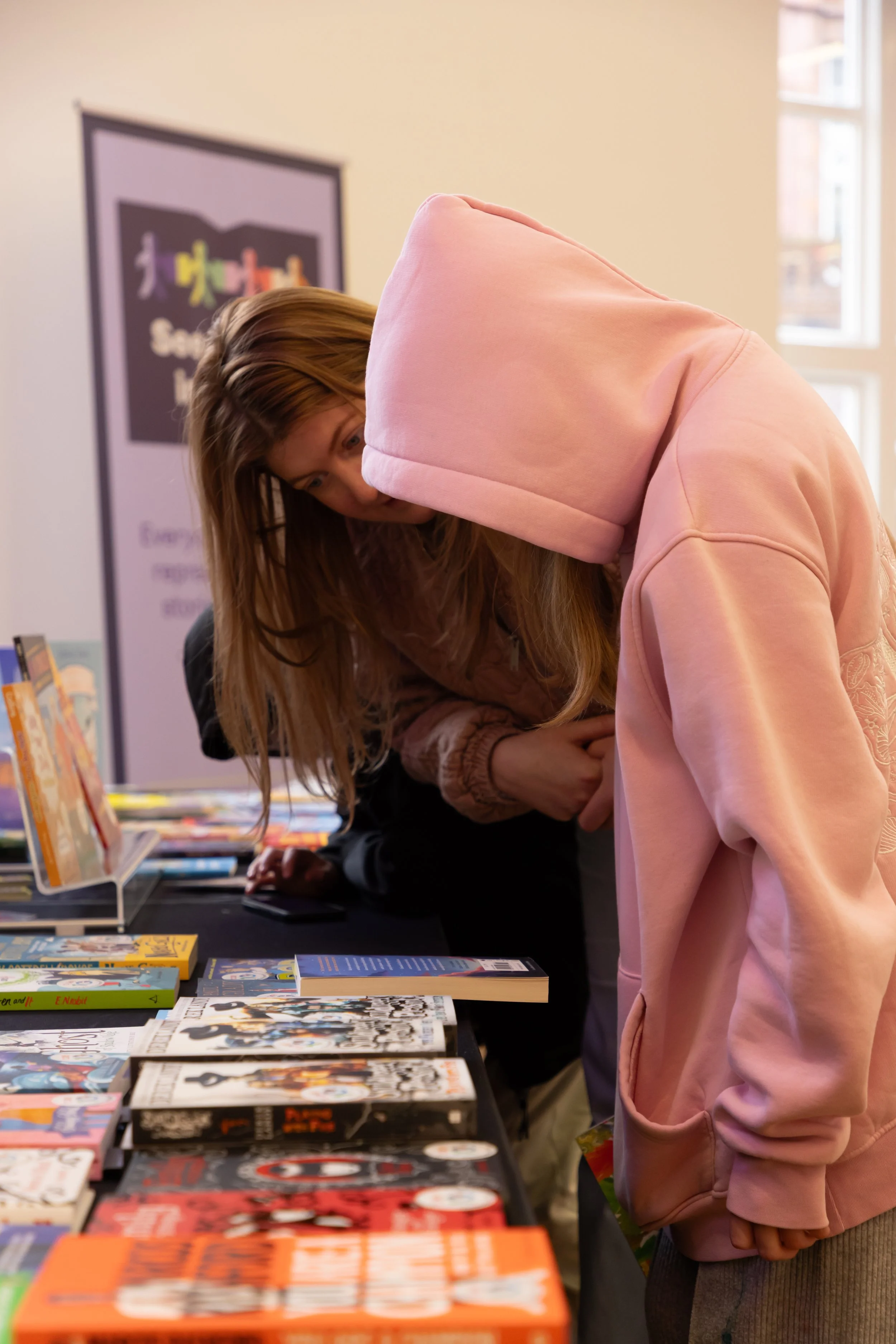 Millie, Inscape House, head down, side view, looking at books.jpg