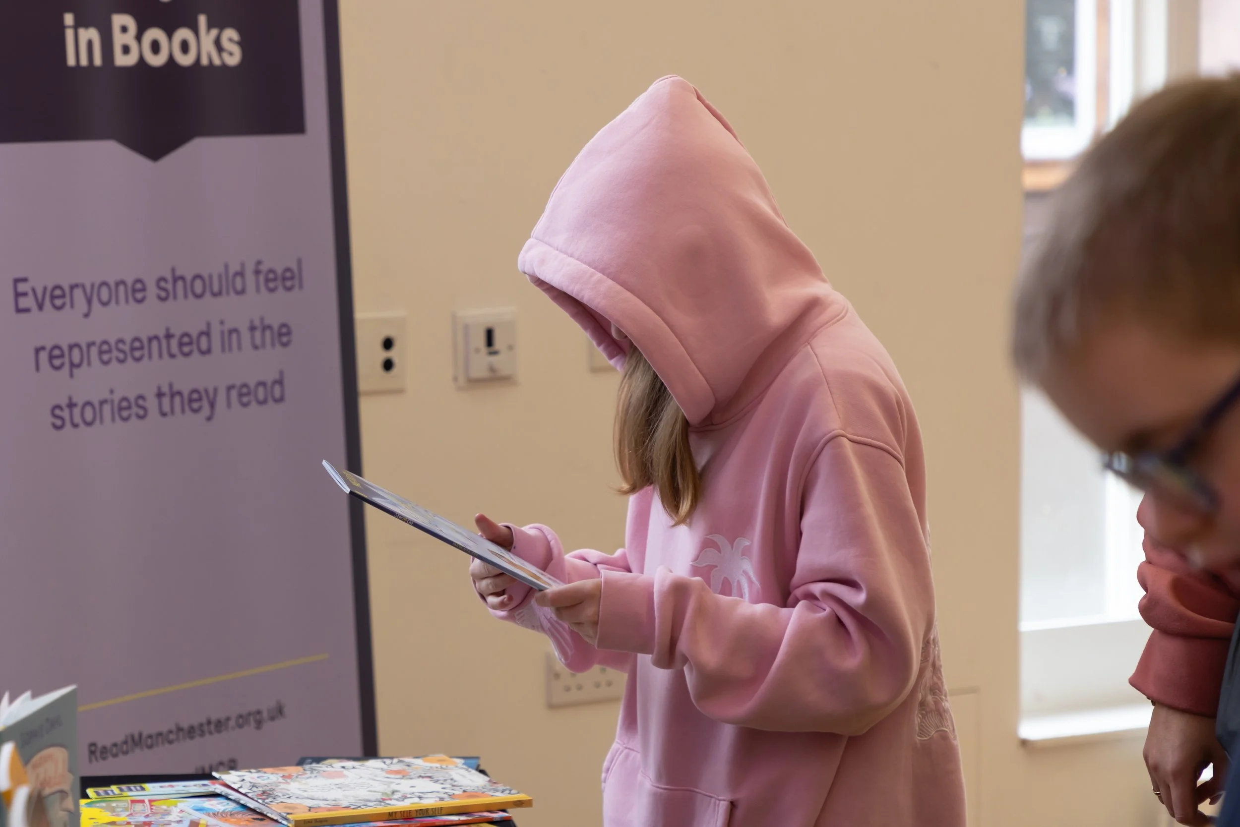 Millie, Inscape House, side view, looking at book.jpg