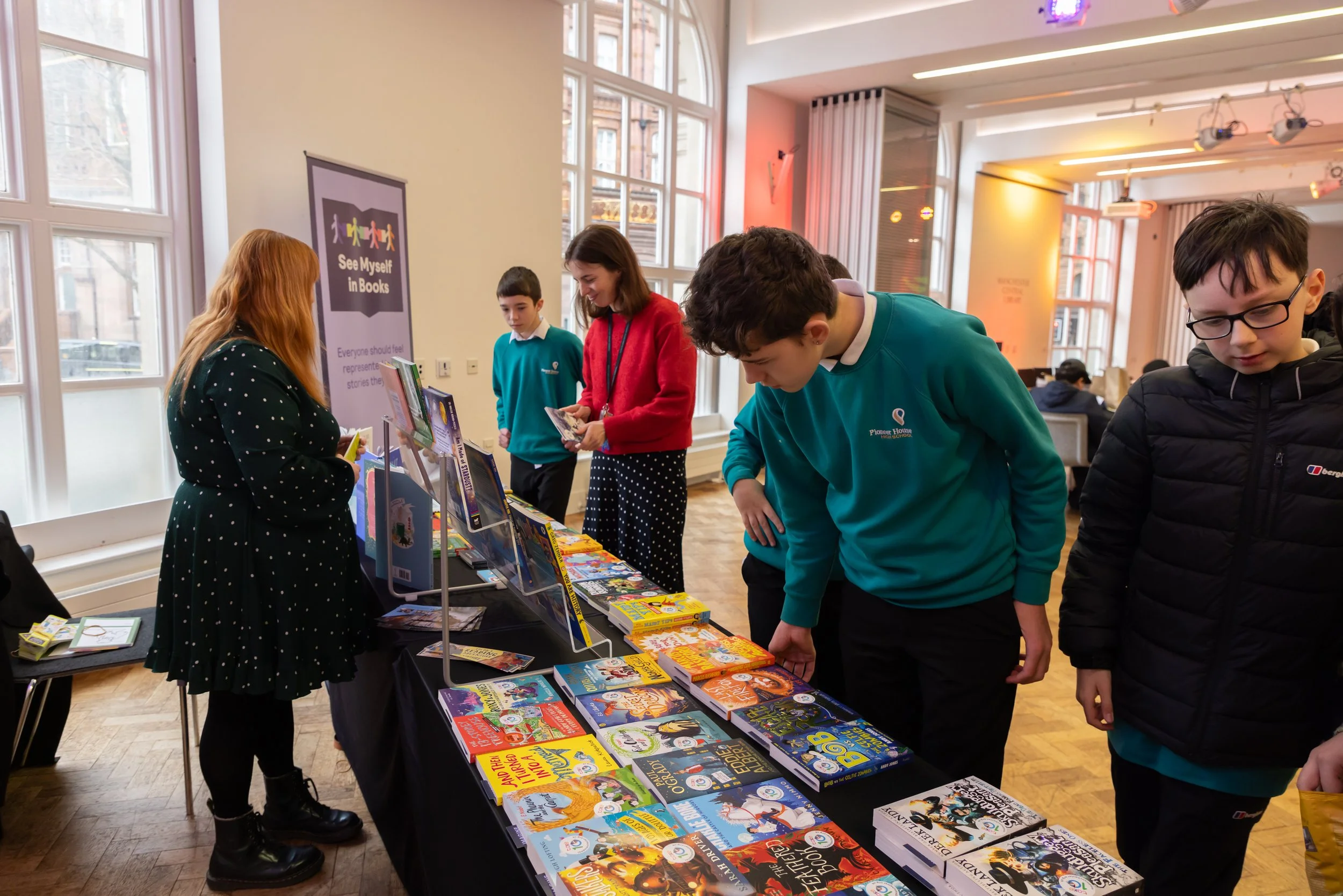 Pioneer House students choosing books 2.jpg