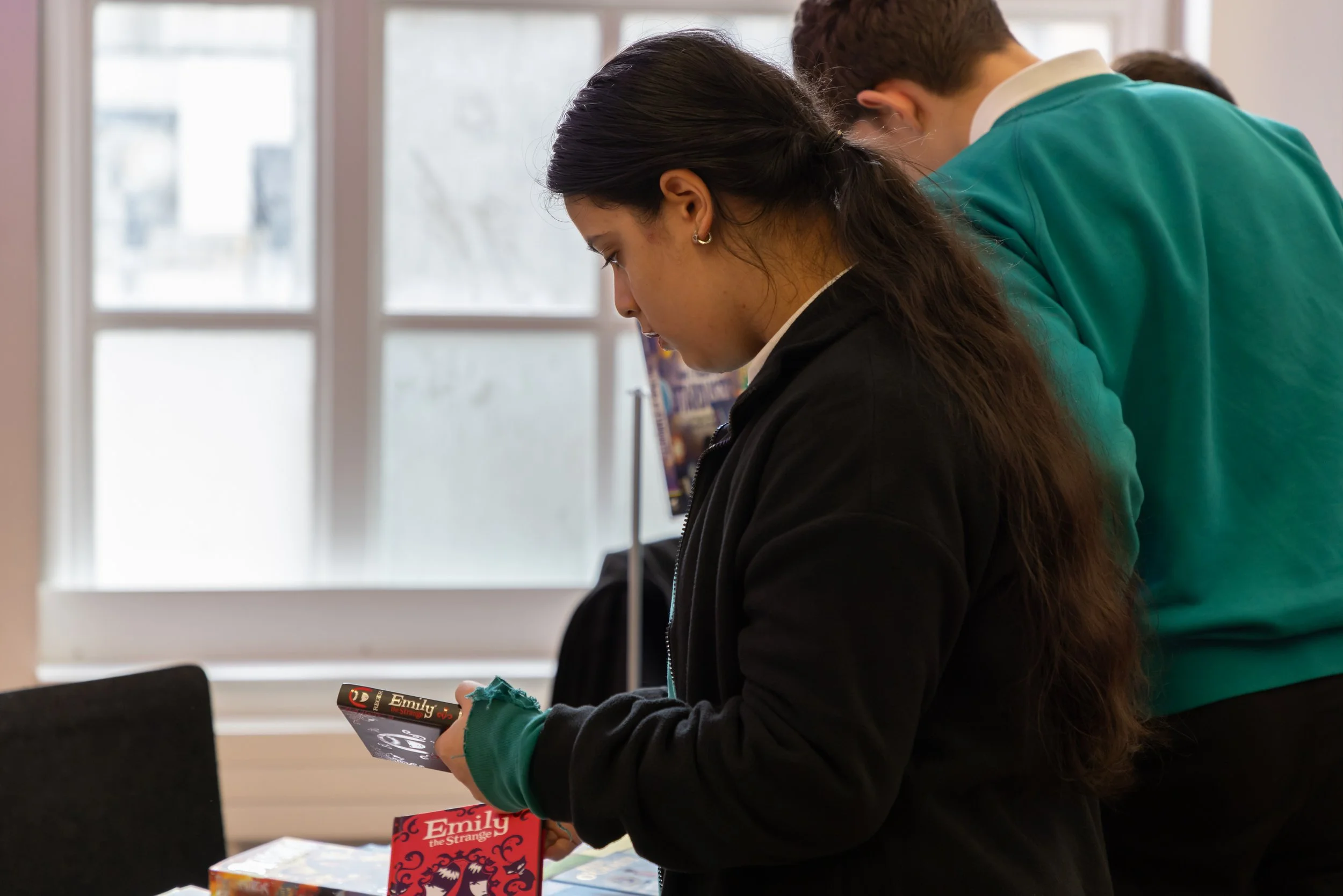 Pionner House student side, choosing a book.jpg