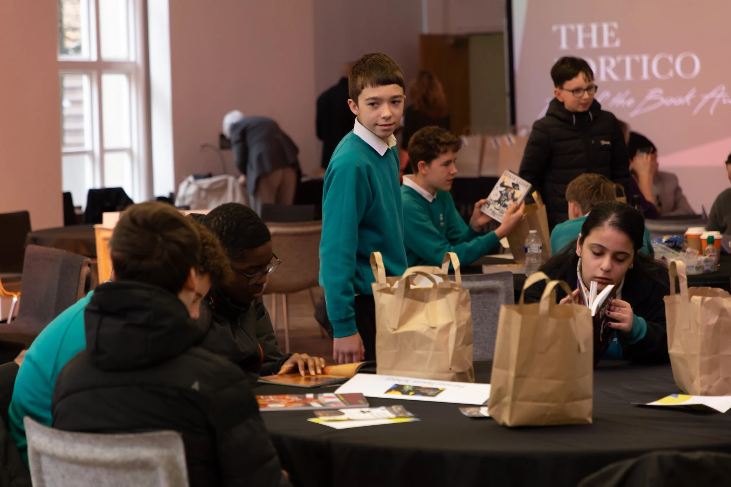 Pionneer House students at their table.jpg
