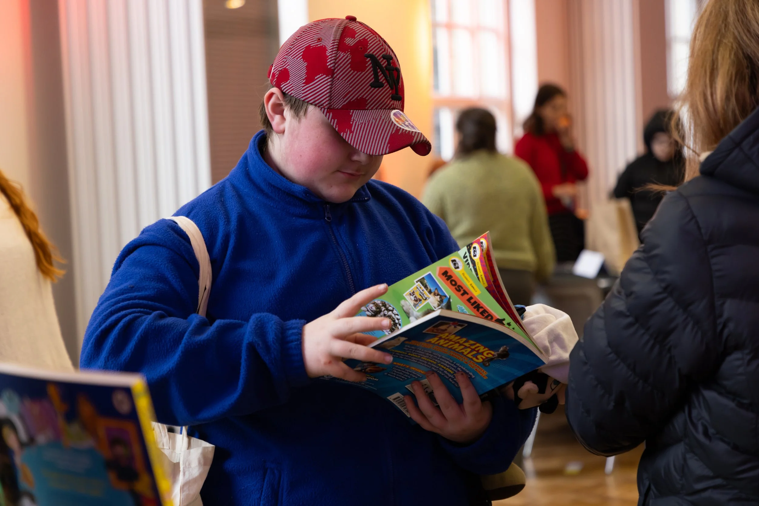 Riley-Jack, Brentwood, close up with book turning pages.jpg