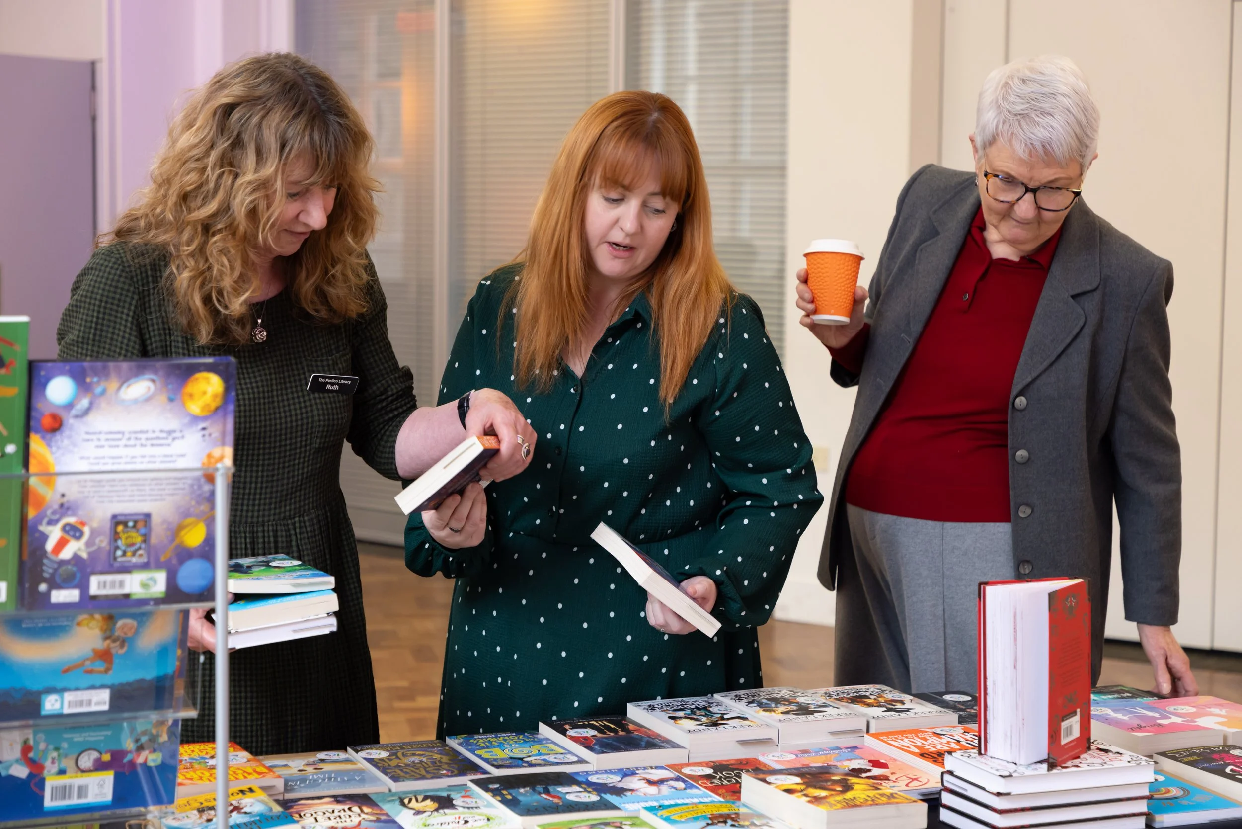 Ruth, Caroline and Janet looking at books.jpg