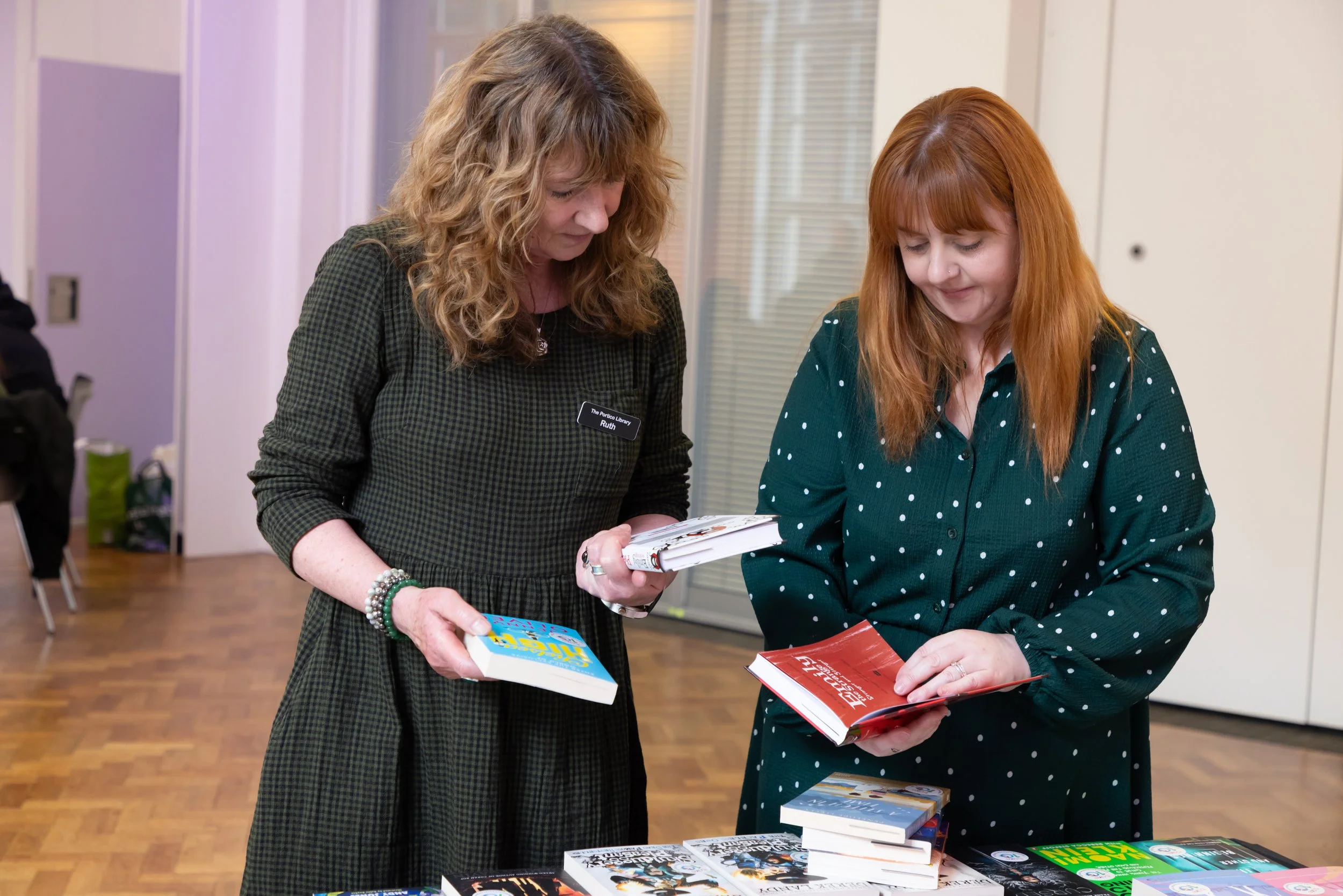 Ruth and Caroline choosing books for MHS students.jpg