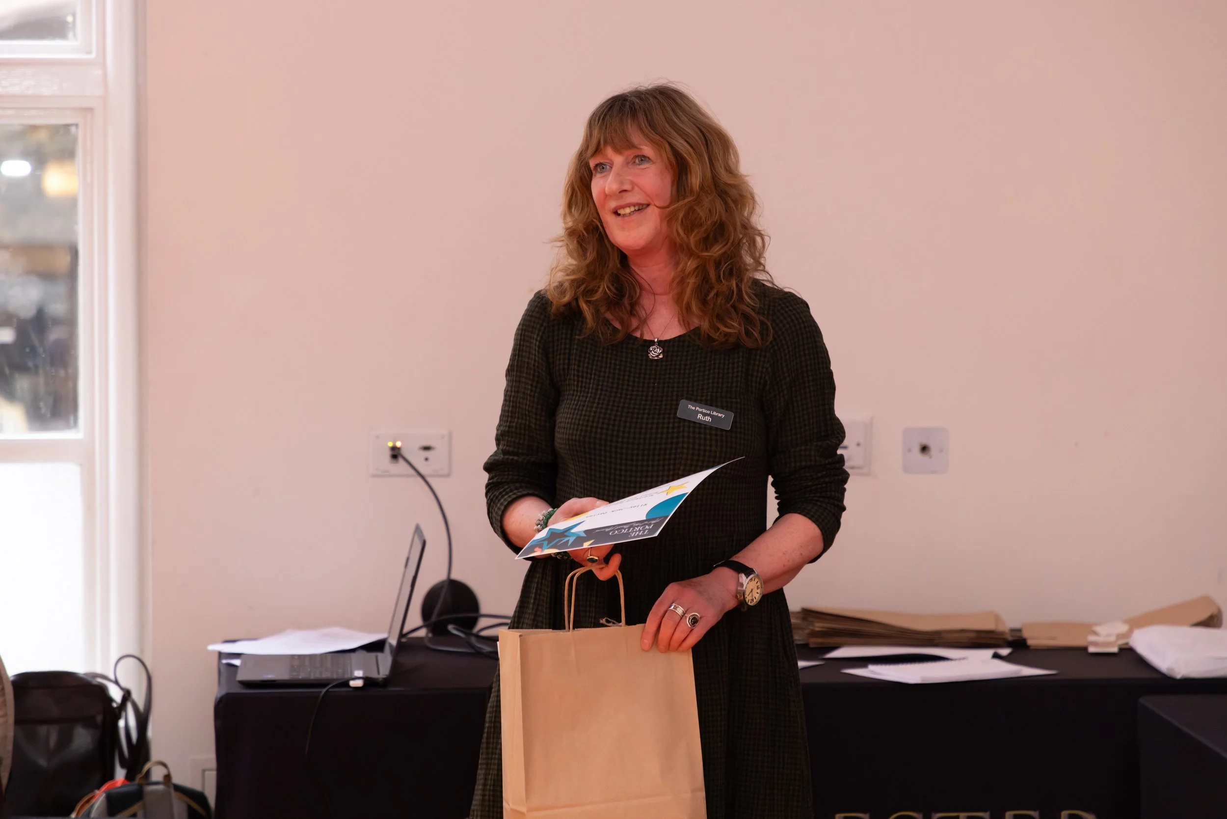 Ruth holding certificate and gift bag.jpg
