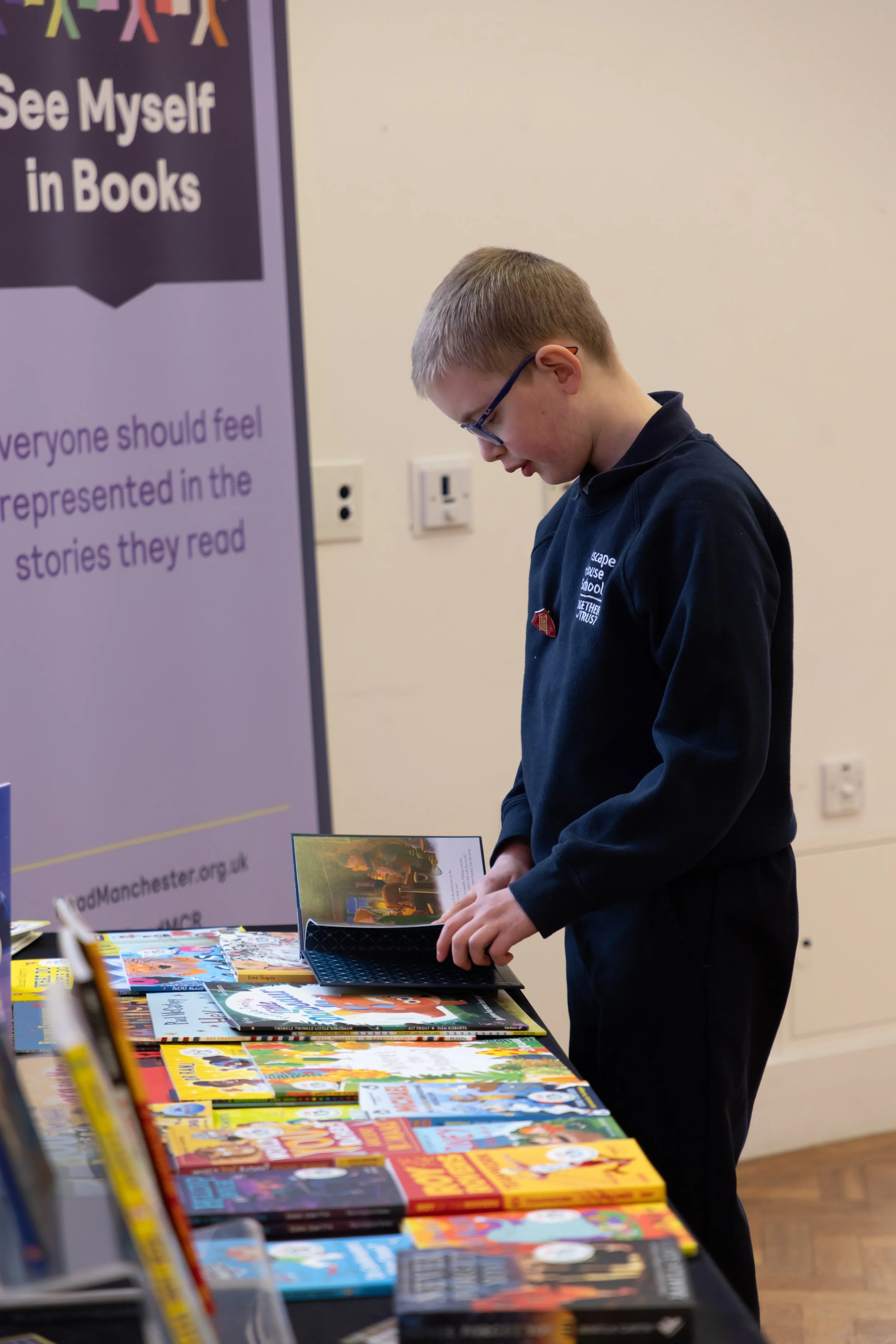 Eddie, Inscape House, side looking at table of books.jpg
