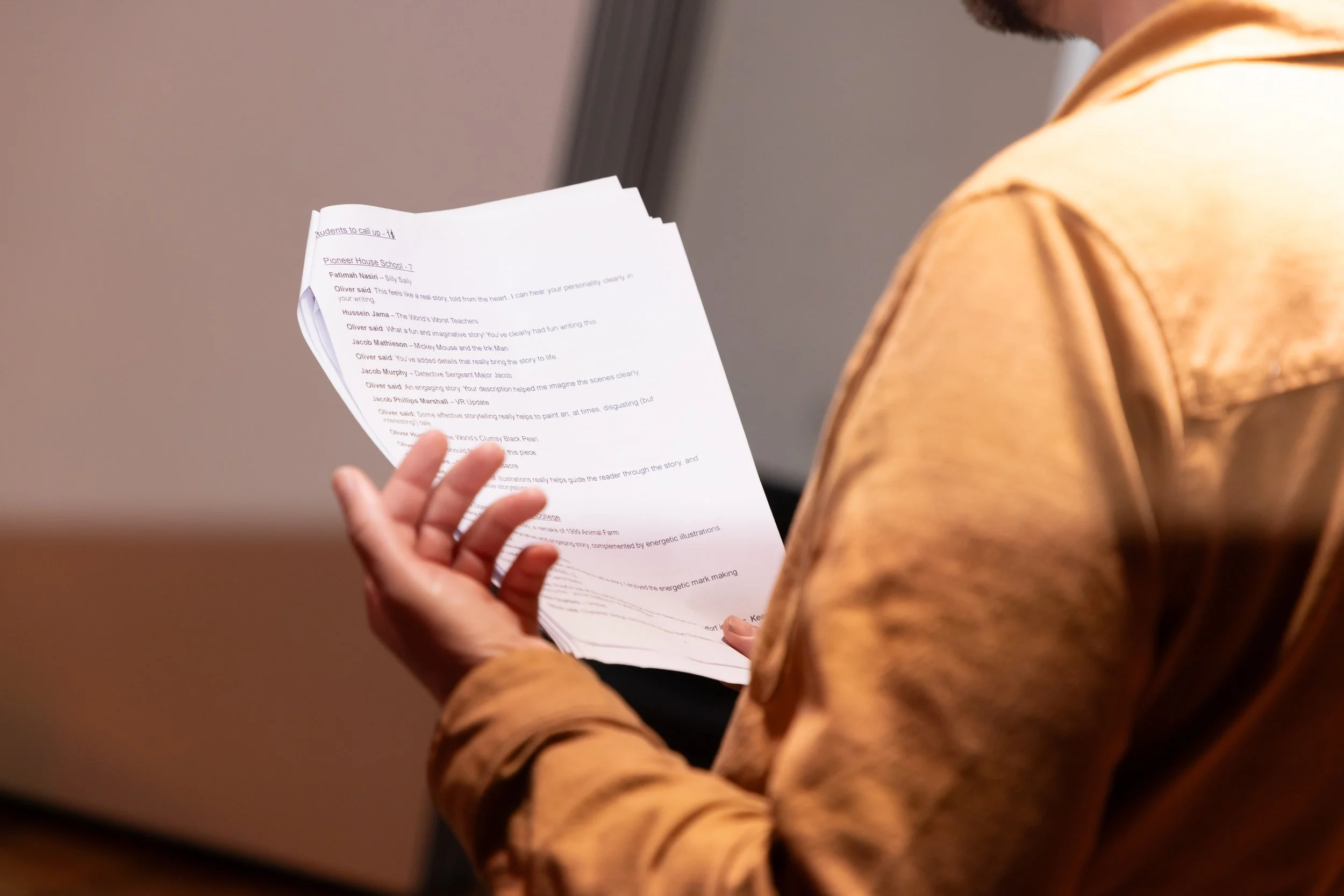 Oliver's hands and winners' list.jpg