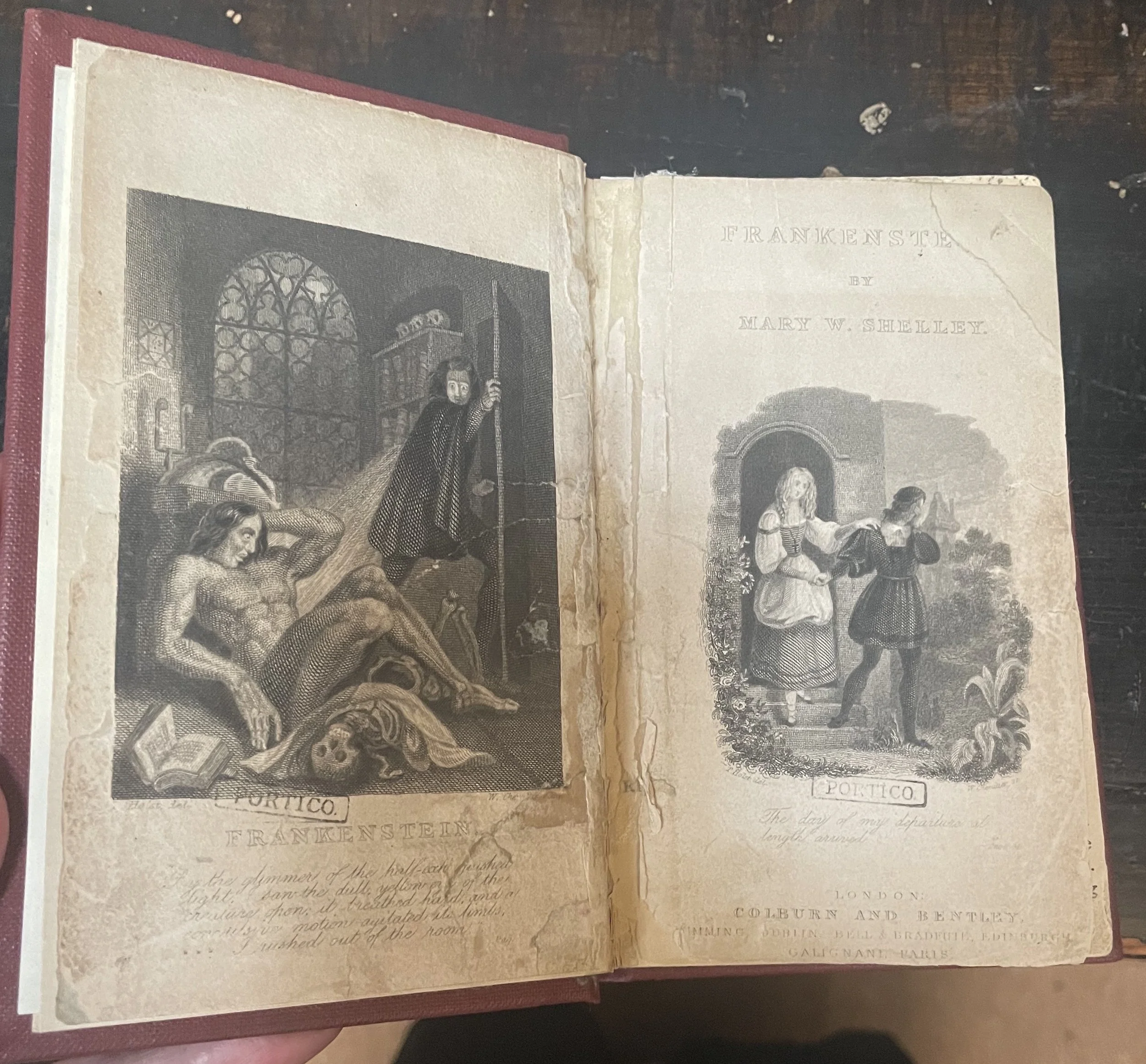 An open book with illustrations of a 'monster' and person coming out of a door with the word Frankenstein
