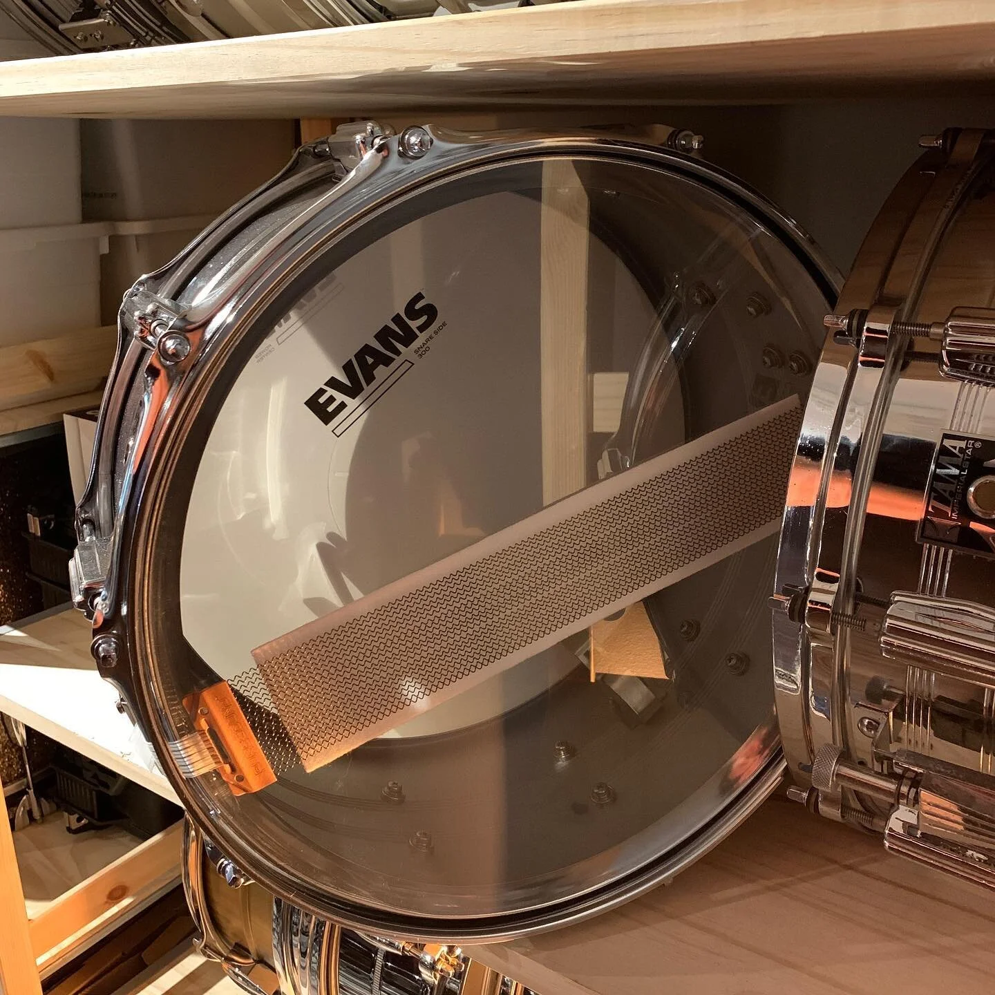 A few people have asked me how I keep the snare drums on my shelves quiet. The answer: felt strips! The same ones you&rsquo;d use to dampen a bass drum. Simply cut them to size. I loosen my snare wires to where they hold the felt strip in place but d