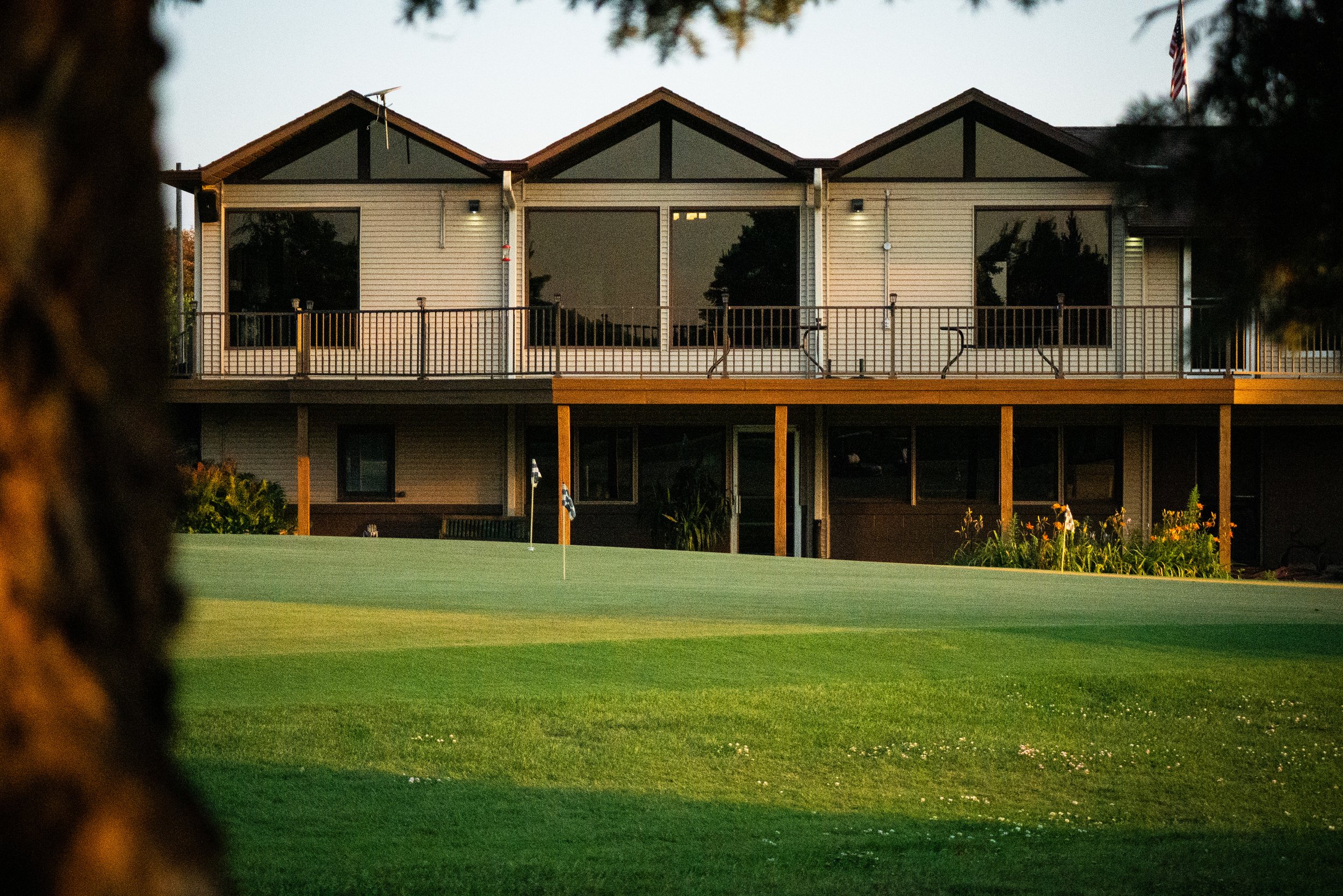 golf course clubhouse overlooking putting practice green