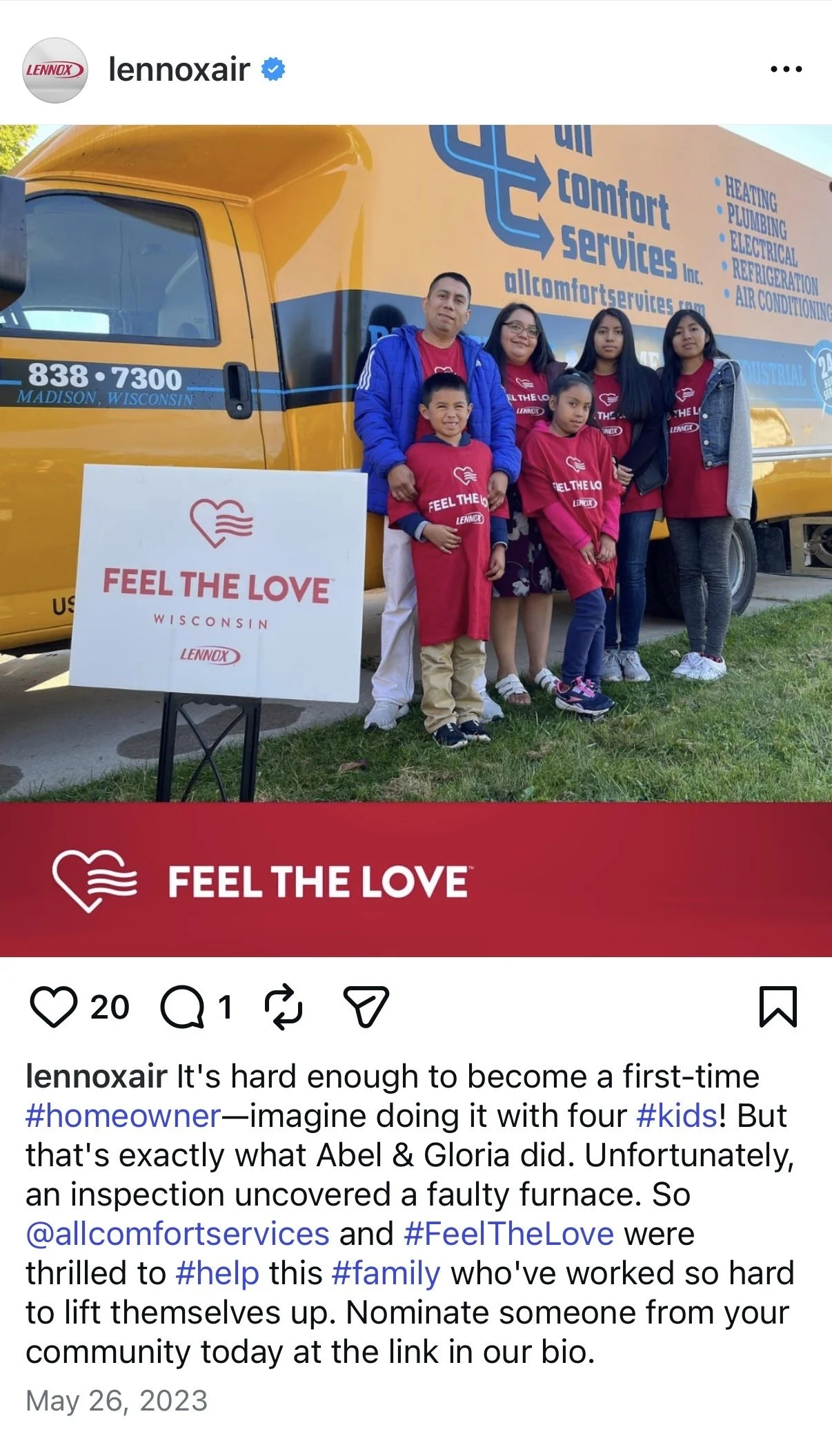 A group of six people, including four children and two adults, standing in front of a yellow service truck with the words 'allcomfortservices.com' and service details. They are wearing red shirts or aprons with the slogan 'Feel the Love.' A sign in front reads 'Feel the Love Wisconsin Lennox.' The group is smiling outside on a sunny day.