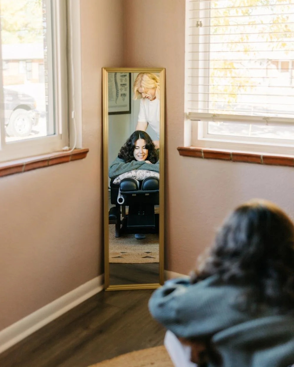 woman with brown hair getting massaged by dr savannah
