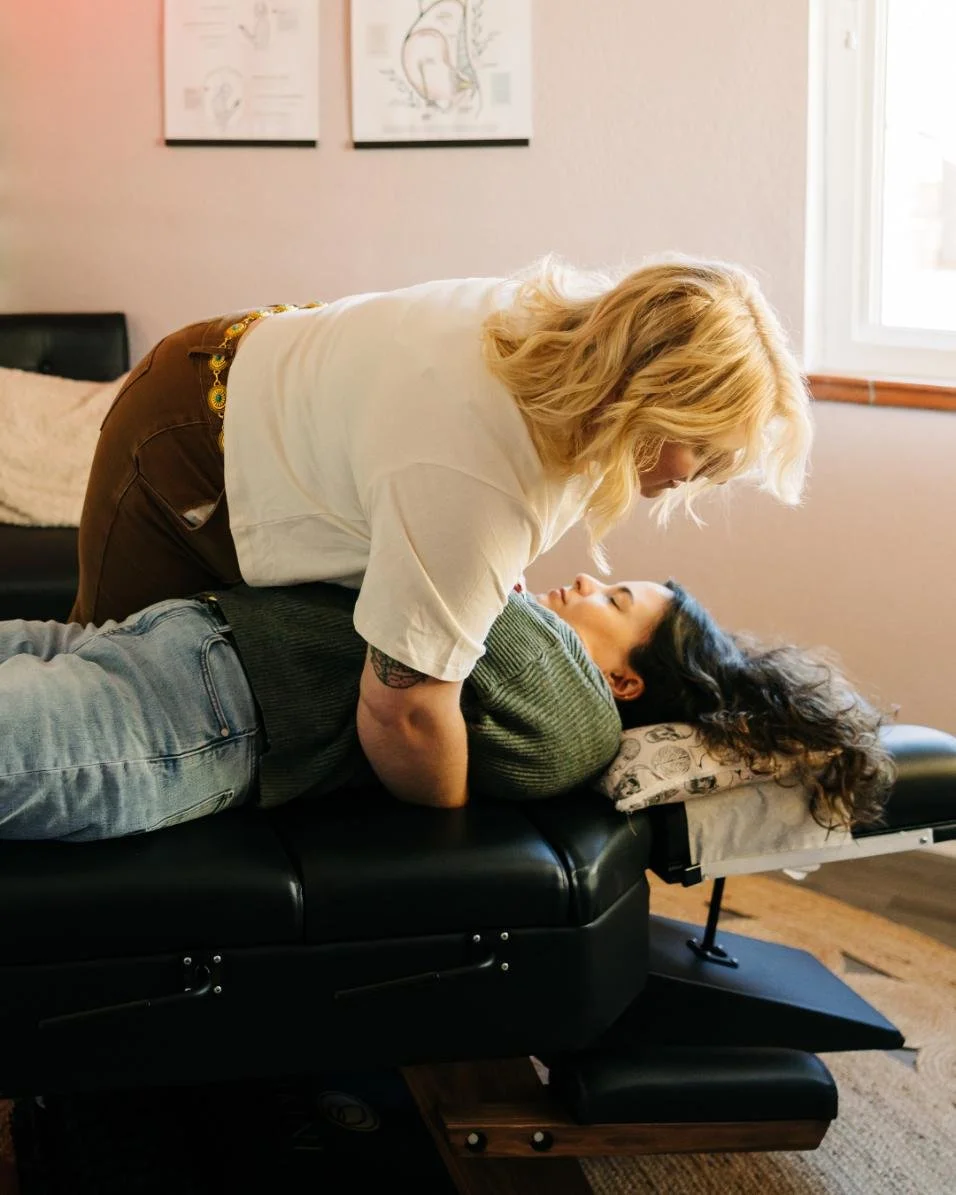 blonde nervous system chiropractor adjusting a patient