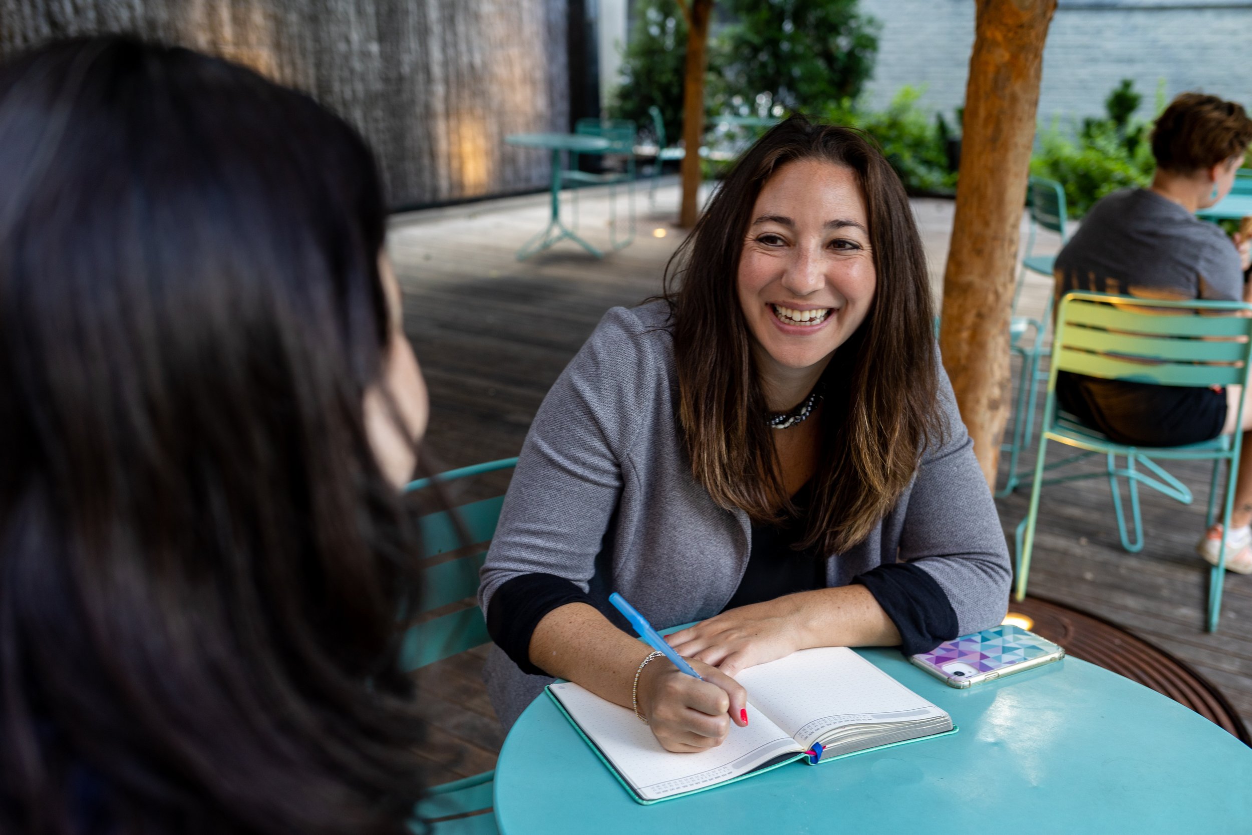 Susan Kahan meeting with a client and discussing fundraising strategy