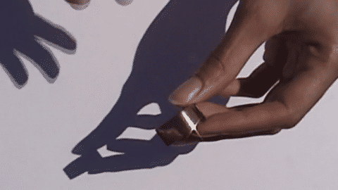Dominique wears Solar Ring 02, size 52, with an 18K Gold — Sterling Silver finish.