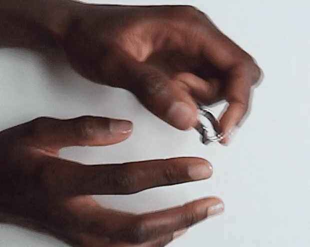 Sokhna wears Wave Ring 01, size 52, with a hypoallergenic Rhodium — Sterling Silver finish.