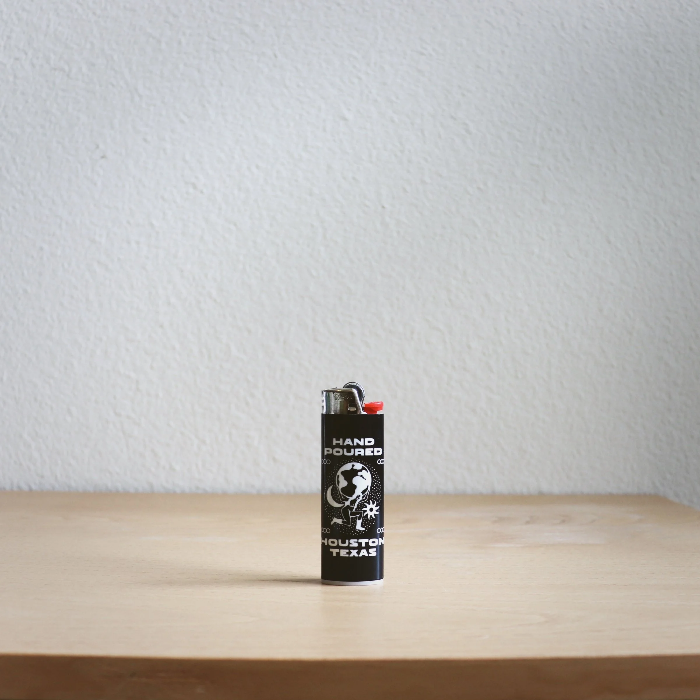 A lighter featuring an image of a man, showcasing a unique design element for personal use or collection.