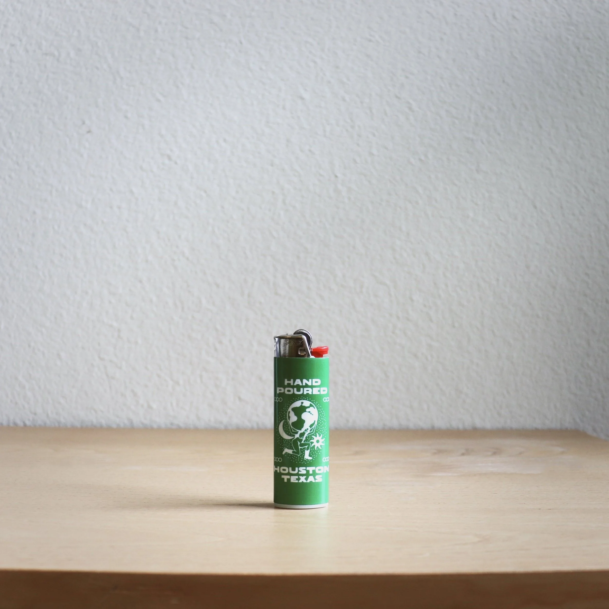 A decorative lighter displaying a picture of a man, adding a personal touch to a common everyday item.