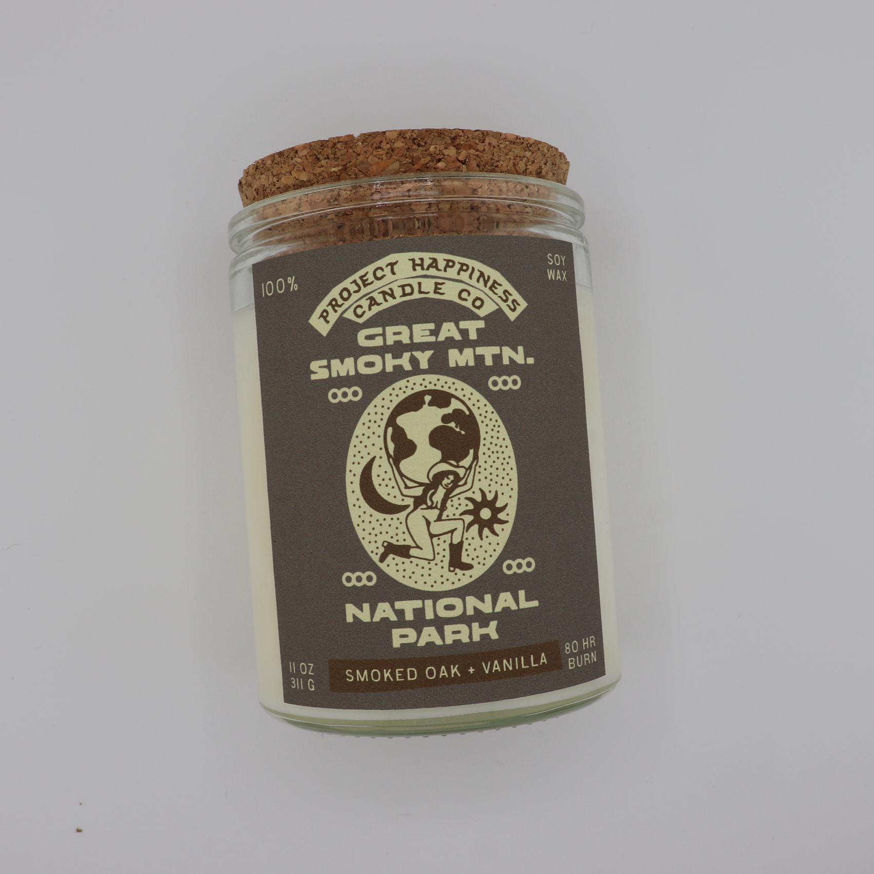 Smoked Oak & Vanilla soy candle inspired by Great Smoky Mountains National Park, featuring warm notes of oak, palo santo, patchouli, smoke, vanilla, and wood. Burns for 80–100 hours.