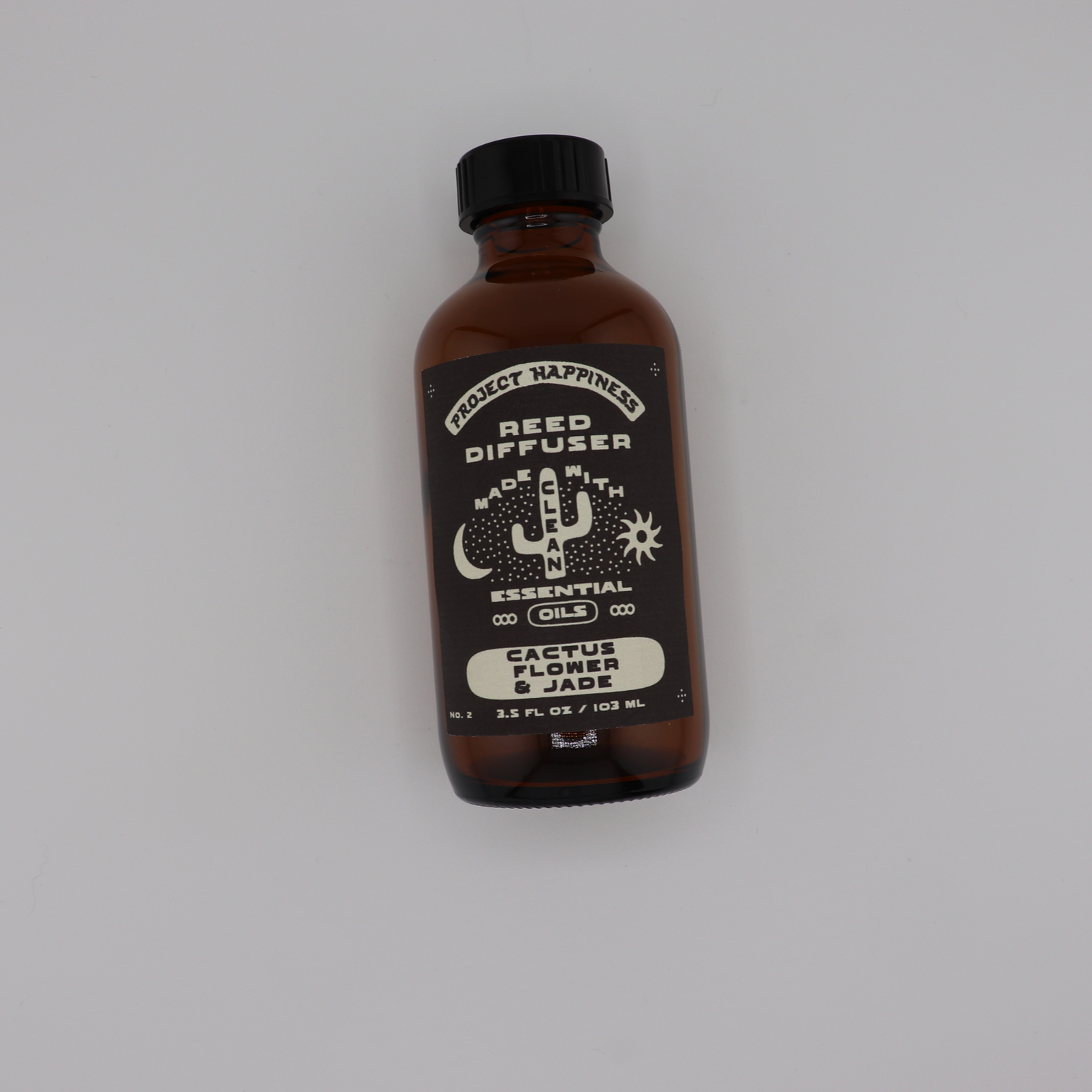 Cactus Flower & Jade Reed Diffuser in an amber glass bottle with black reeds, featuring fresh agave, aloe, green florals, and patchouli for a clean, calming fragrance. Lasts 3–4 months.