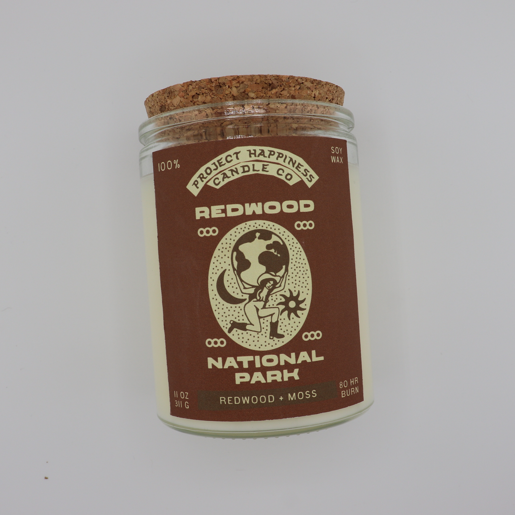 Campfire soy candle inspired by Redwood forests, featuring warm notes of saffron, eucalyptus, sandalwood, cypress, smoke, and amber. Burns for 80–100 hours.