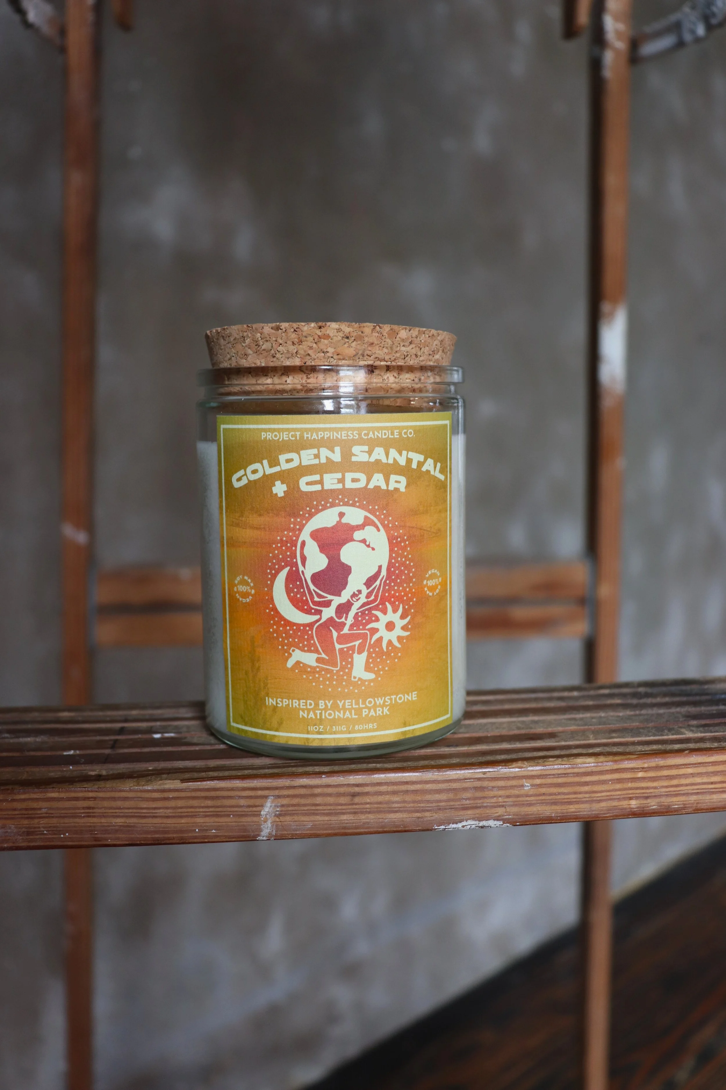 Golden Santal and Cedar soy candle, featuring a warm, inviting glow and a rich, earthy fragrance.