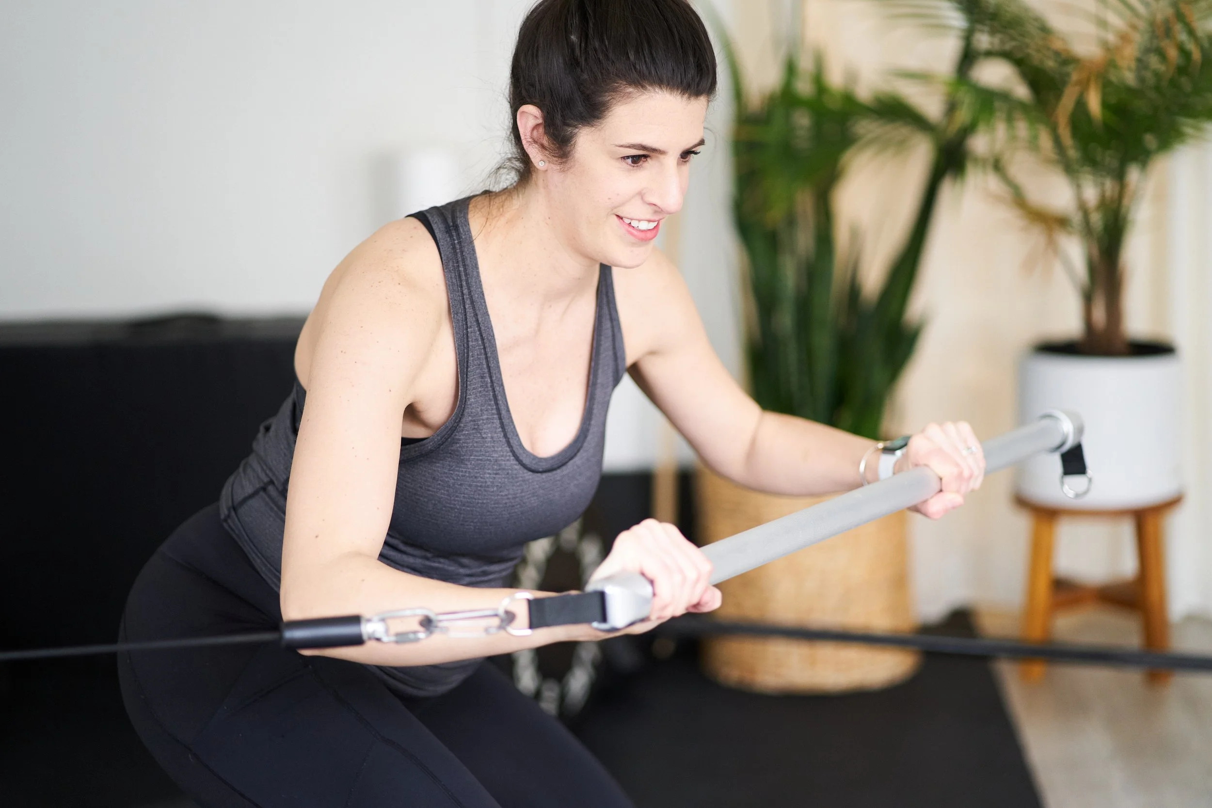 Dr Laura Latham exercising using cable machine
