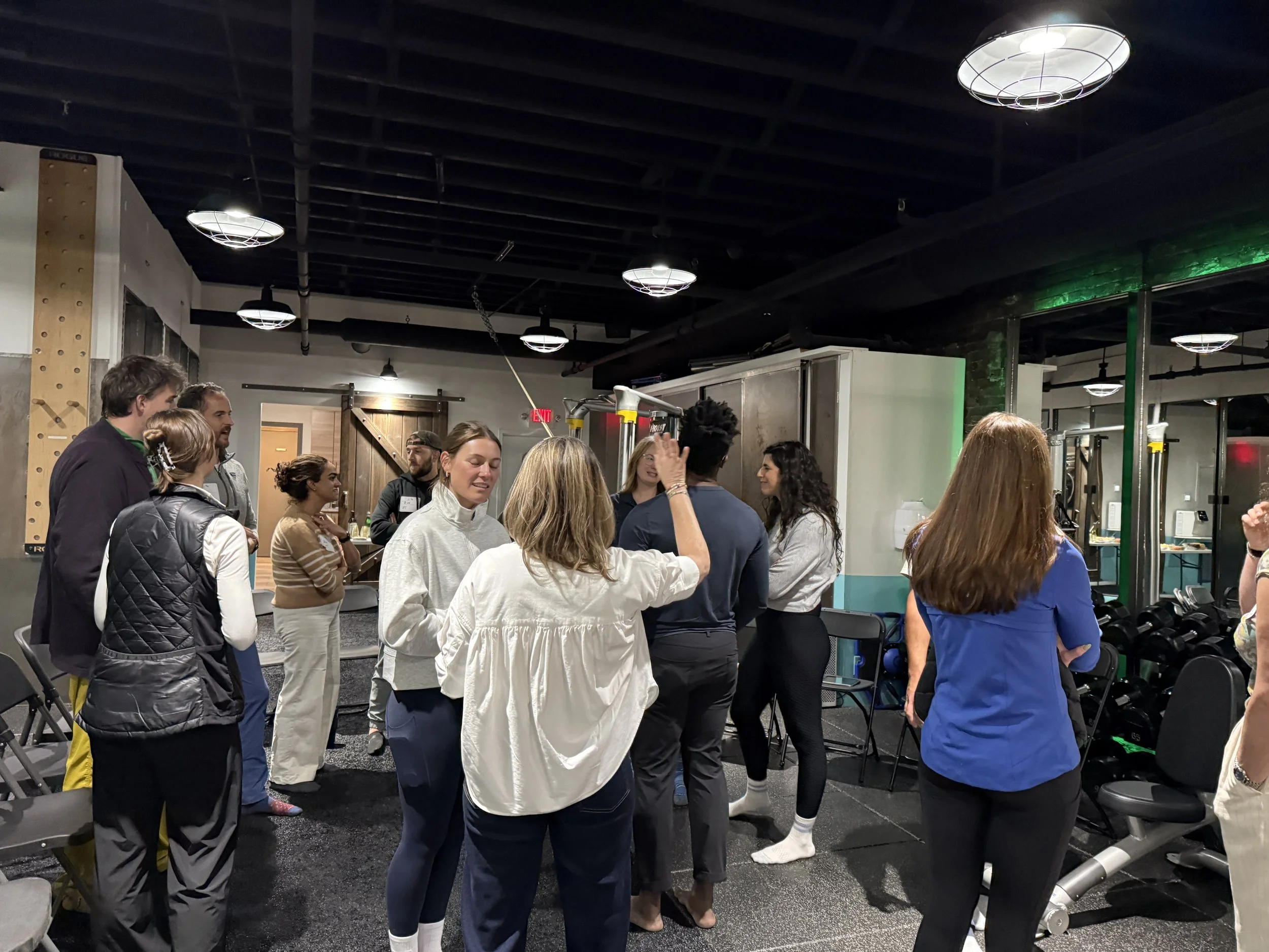 health and fitness professionals networking, discussing back pain