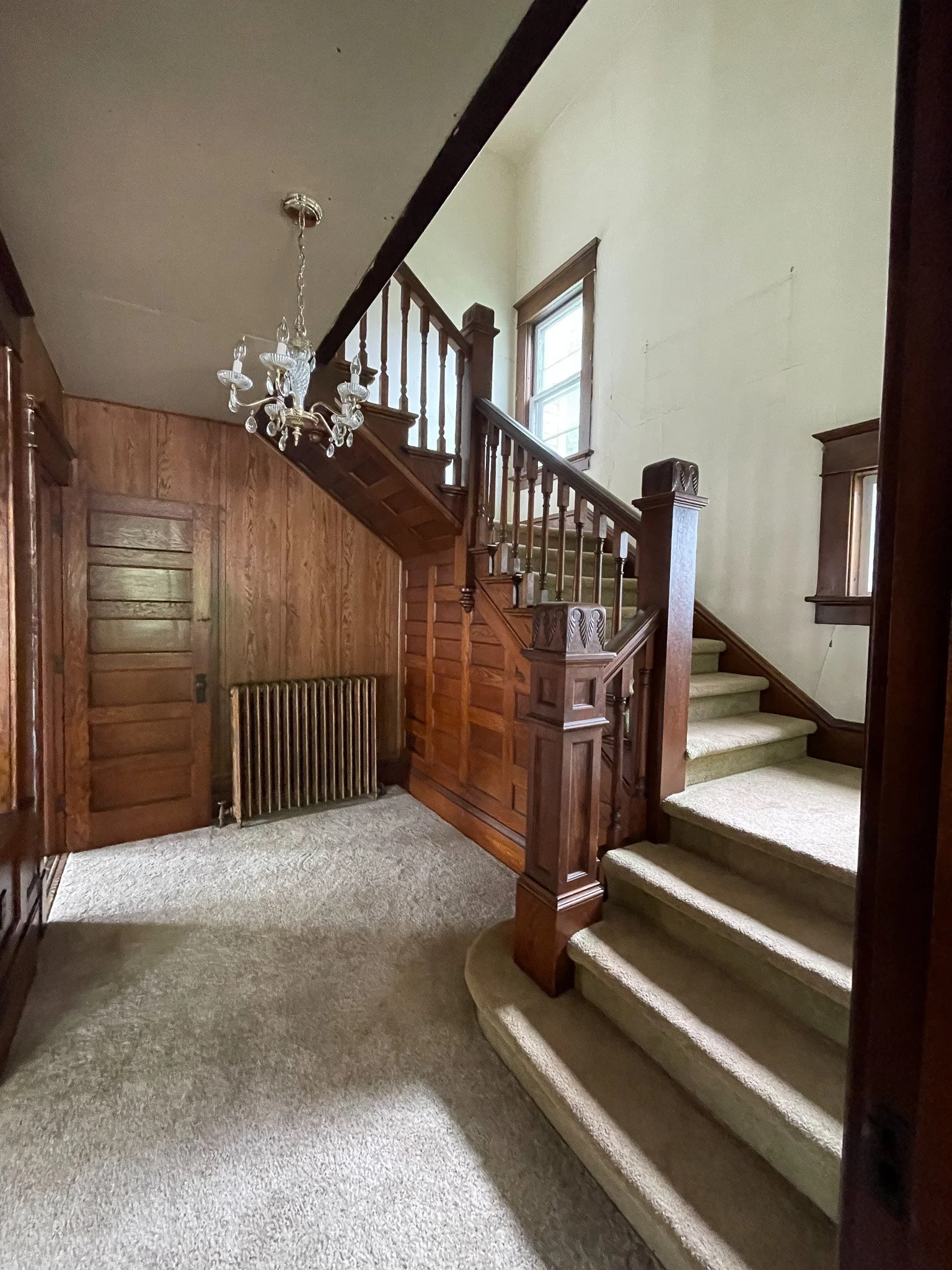 Welcome to our foyer!  We're obsessed with the gorgeous staircase! 
