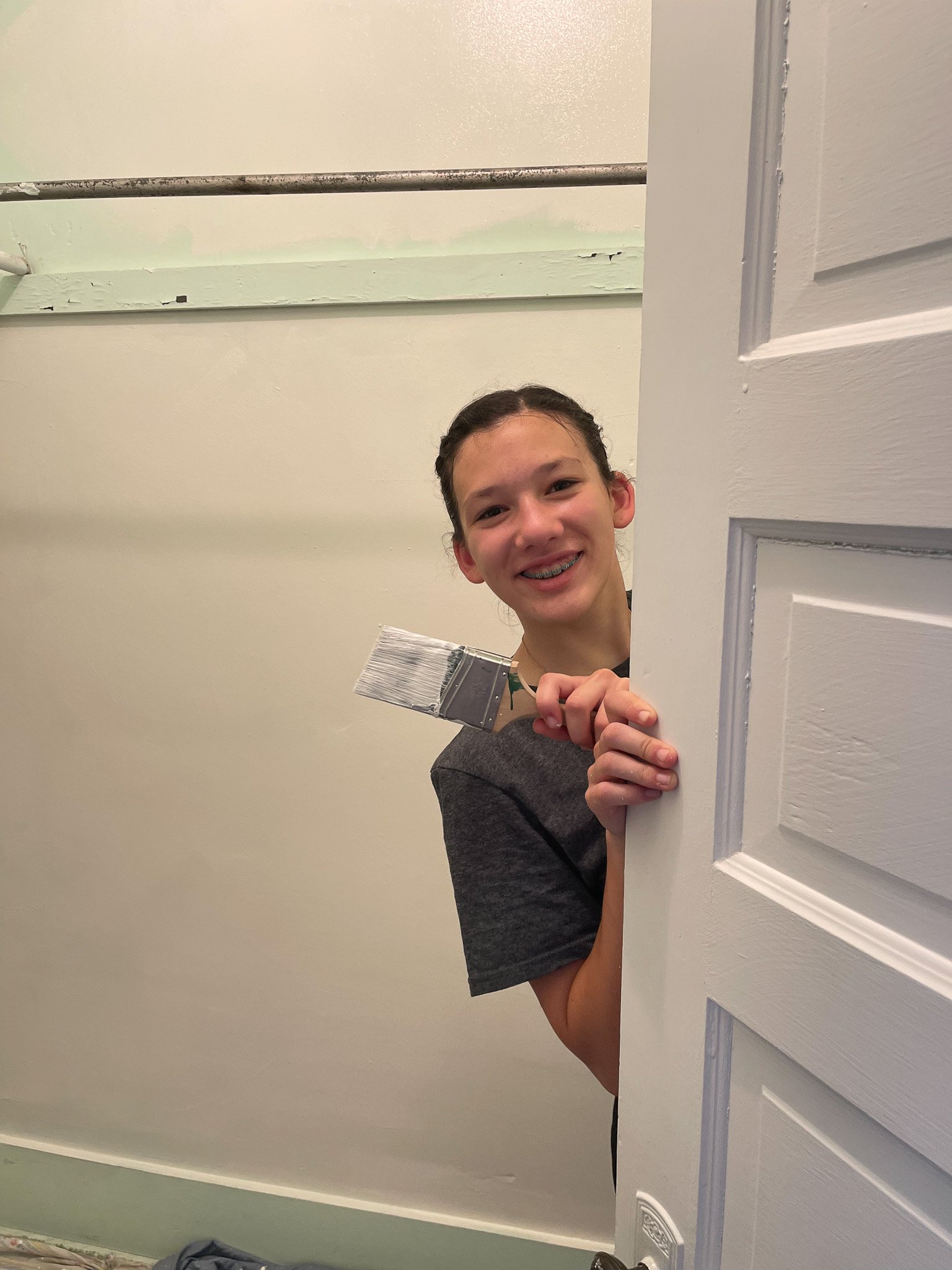 We'll pop in on our cute little painter, painting her closet.