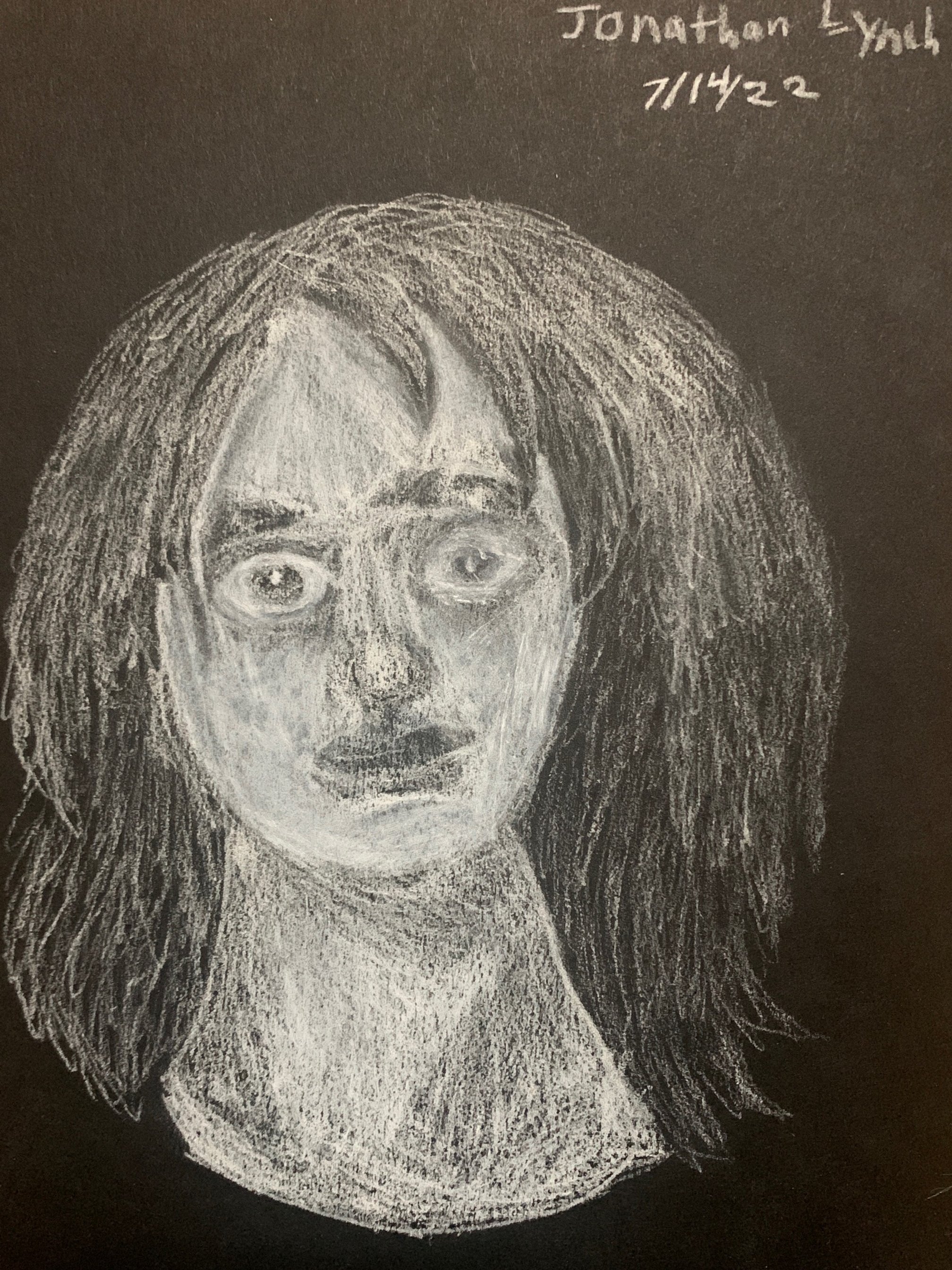 Trey Lynch: White Charcoal on Black paper.
Assignment: Turning negative into a positive with self portrait