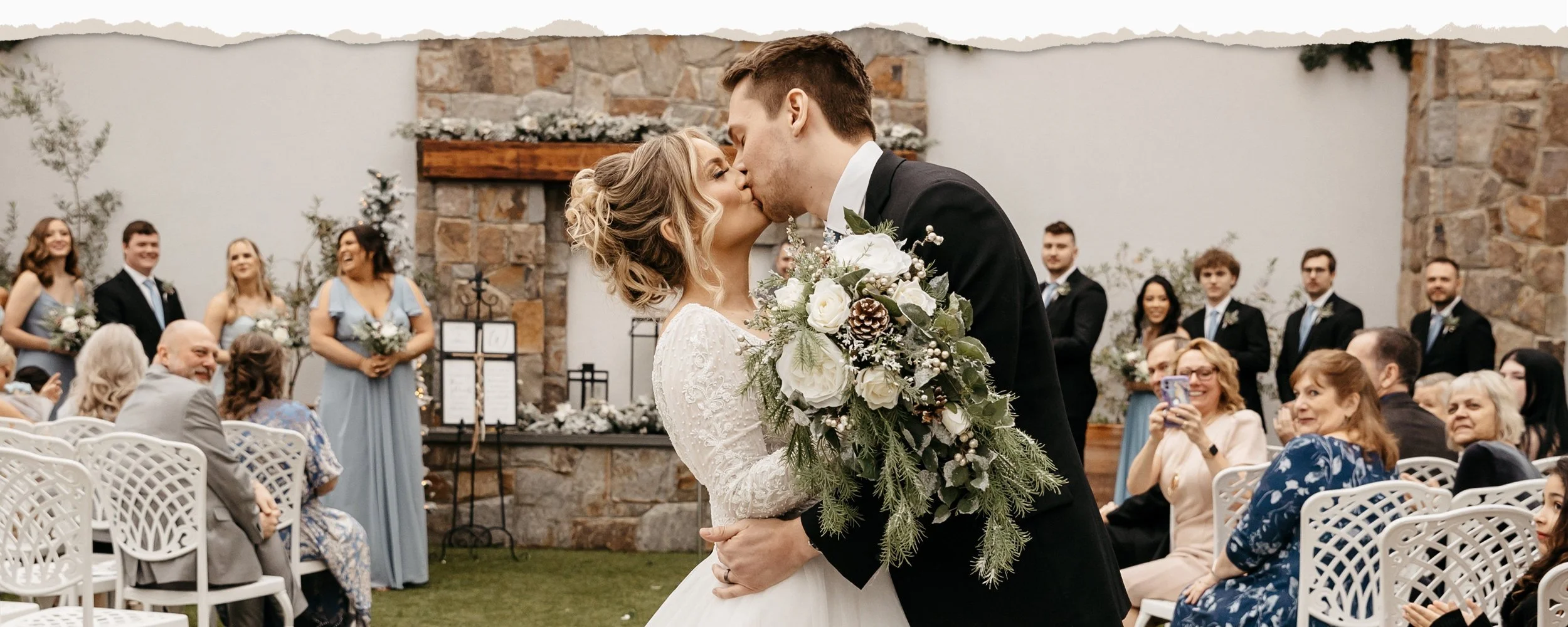 Winter Pine Wedding Flowers in Ivory with Snow Accents - Inspired by Farmhouse Christmas Weddings, this handmade collection is a soft mix of artificial pine, ivy, juniper, faux snow, real white-tipped pine cones, and ivory silk flowers. The comfortab