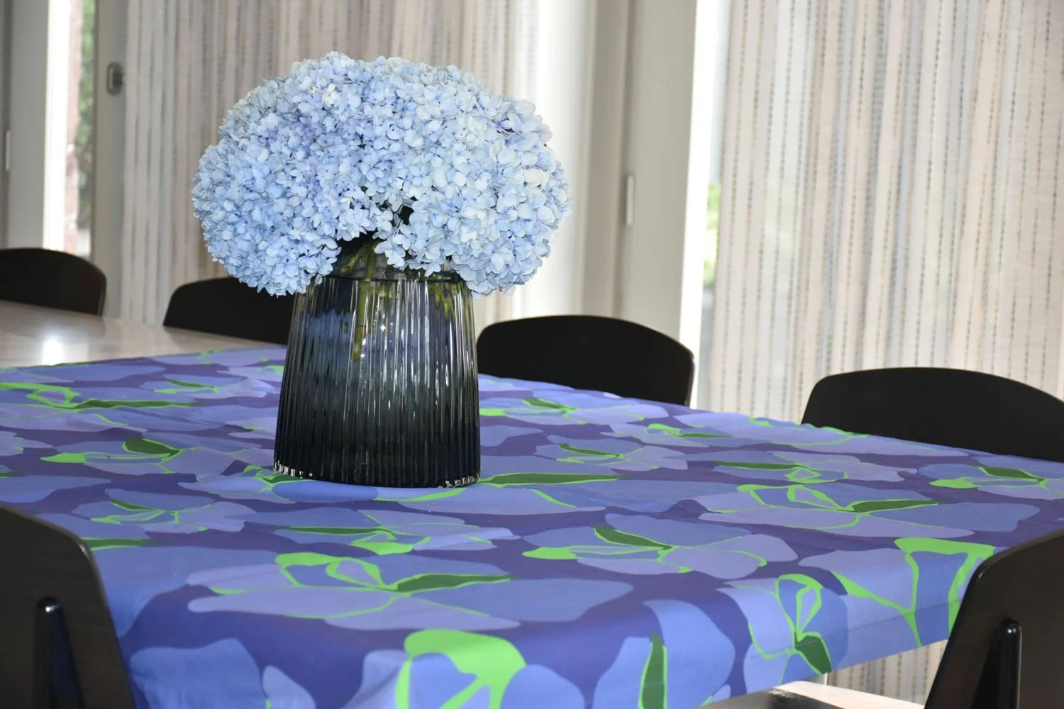 Tablecloth in blue and green Pansy allover print with blue hydrangeas — designer table textiles by Kaisa Valtakari