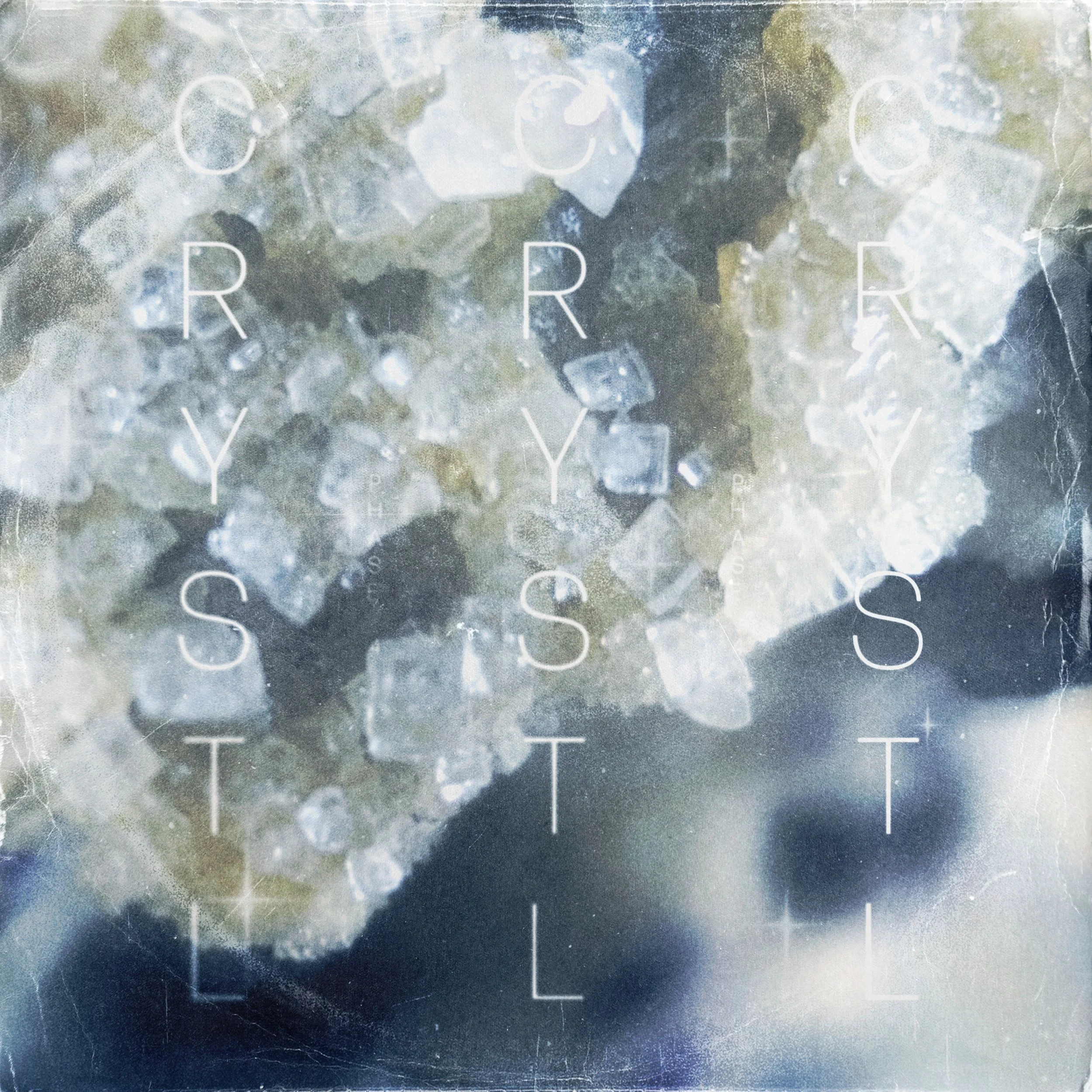 Close-up of a surface with salt crystals and ice, overlaid with the words 'Crystal Structure' in a faint white font.