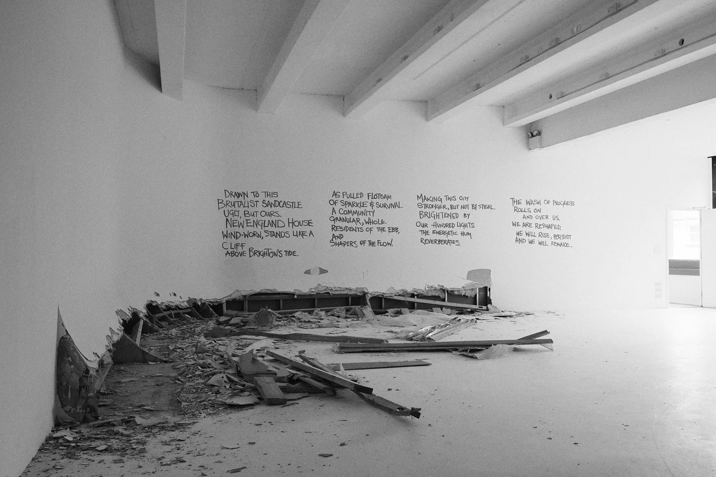 🖤

Drawn to this 
Brutalist sandcastle,
Ugly, but ours.
New England House.
Wind-worn, stands like a cliff
above Brighton&rsquo;s tide

As pulled flotsam
of sparkle and survival
a community
granular, whole.
Residents of the ebb,
and shapers of the fl