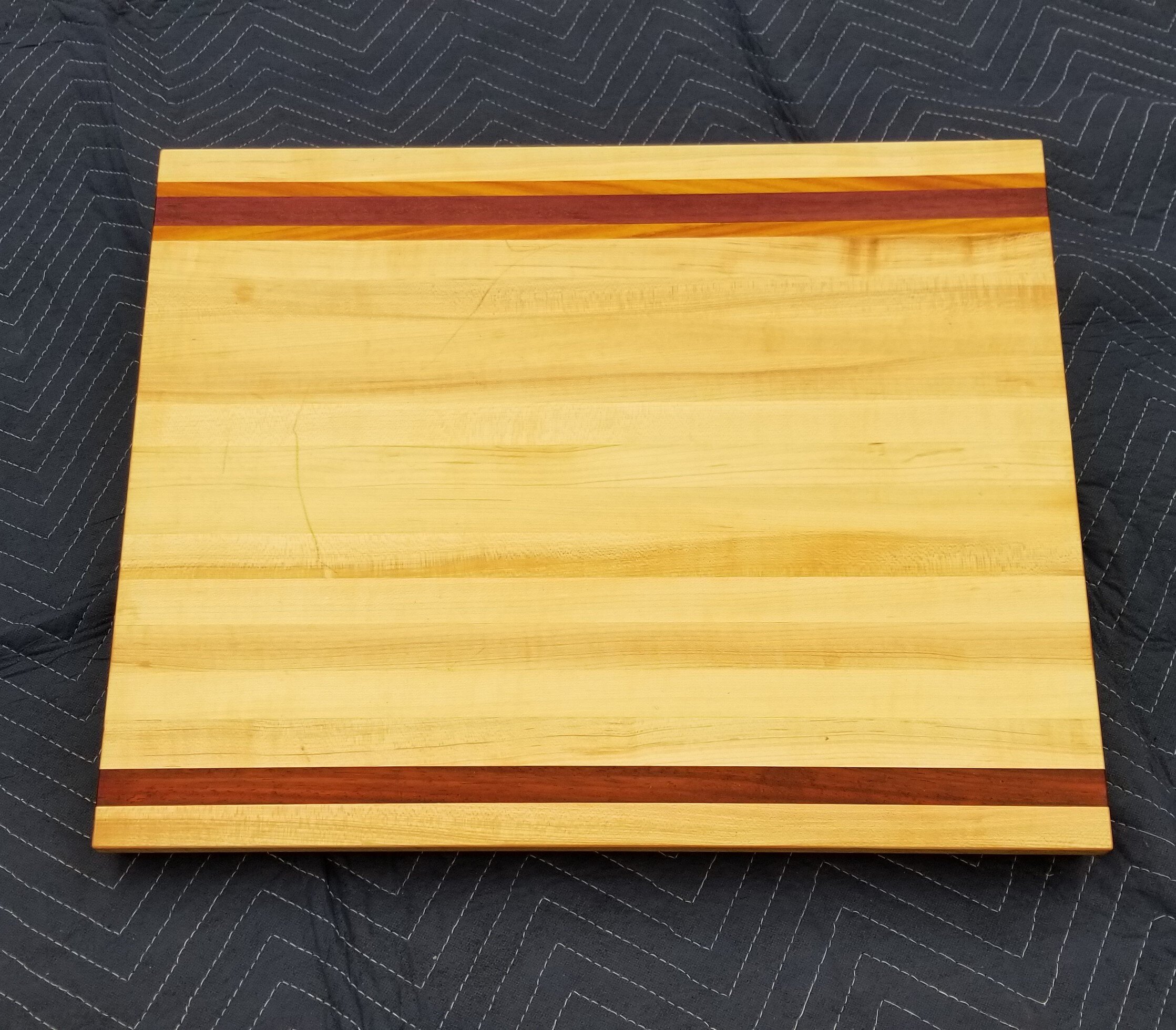 Cutting board with hand hold