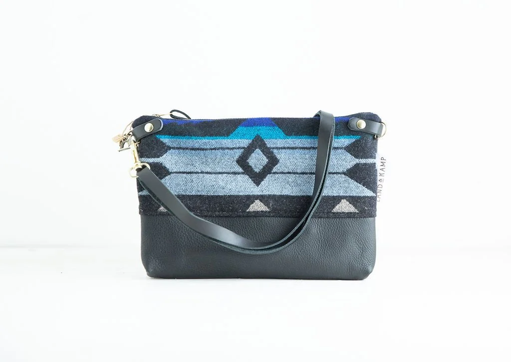 Detail view of the River Salmon wool 3-in-1 wristlet bag featuring YKK zipper and leather trim by Land & Kamp