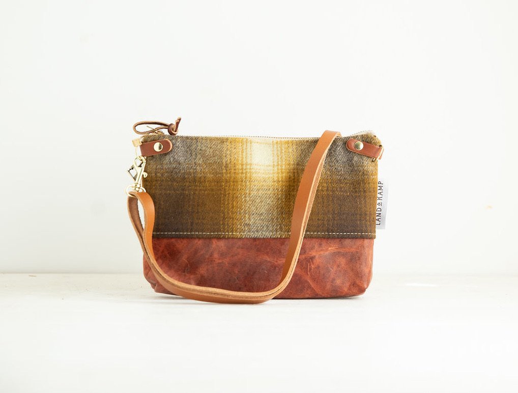 Detail view of the Brown and Gold Ombre wool 3-in-1 wristlet bag featuring YKK zipper and leather trim by Land & Kamp
