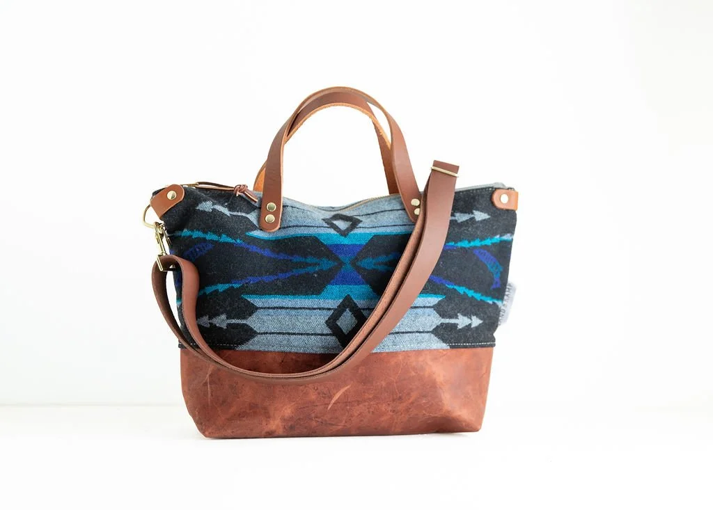 River Salmon wool crossbody purse shown with detailed angles and top-grain leather handles