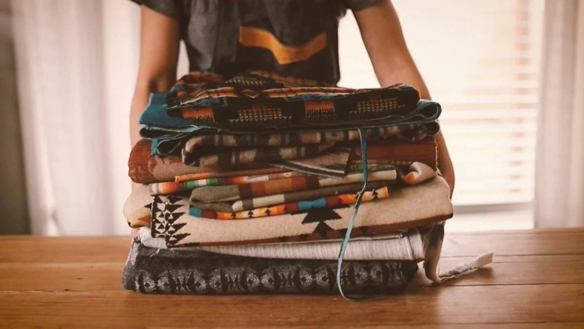 land and kamp owner, jessie holding purse material of Pendleton wool for handmade purses in portland, OR