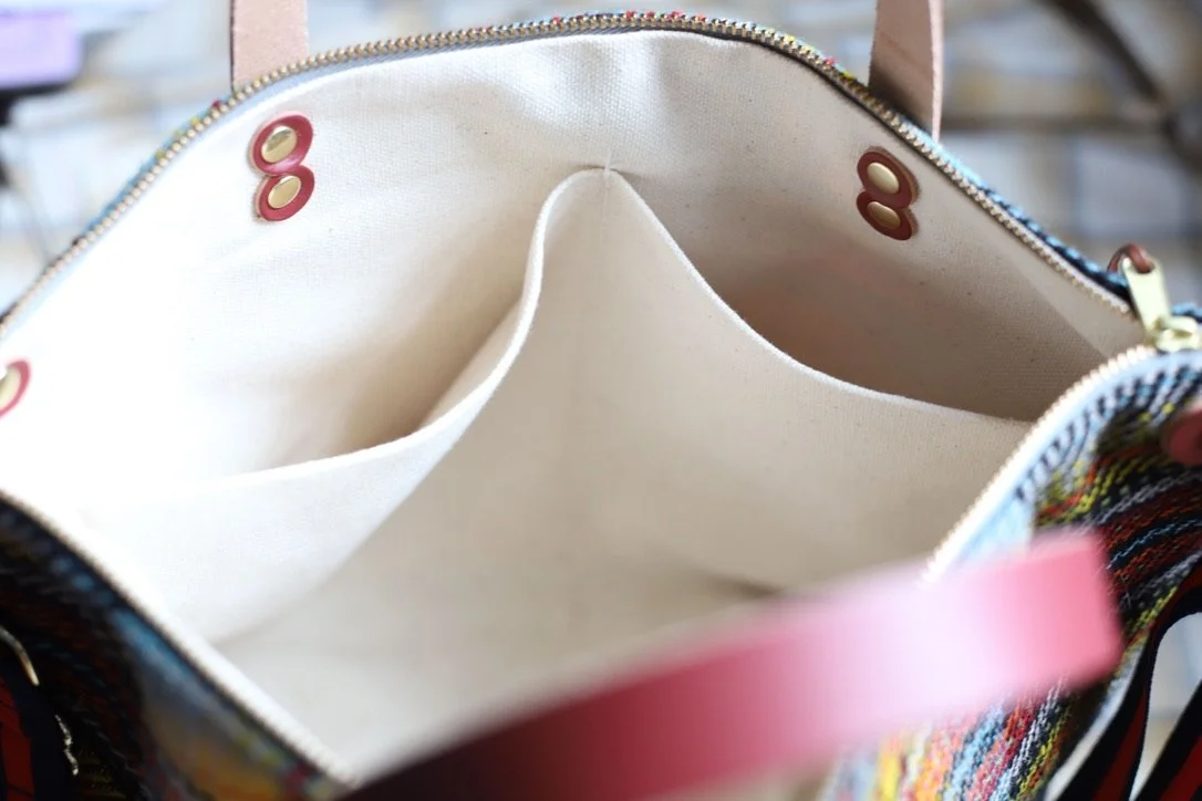 Interior view and construction details of the handmade wool and leather Bitsy purse made with Classic Houndstooth pattern in Pendleton wool by Land & Kamp