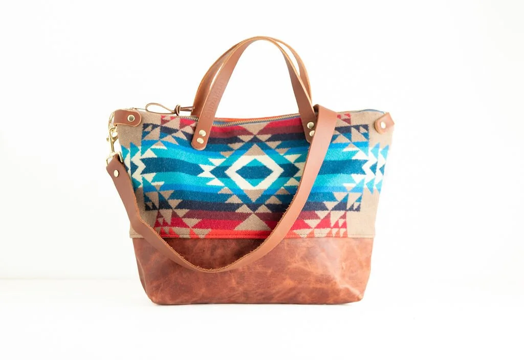 with detachable shoulder strap Handmade Pilot Rock wool crossbody purse with brown leather bottom and handles, crafted in Portland